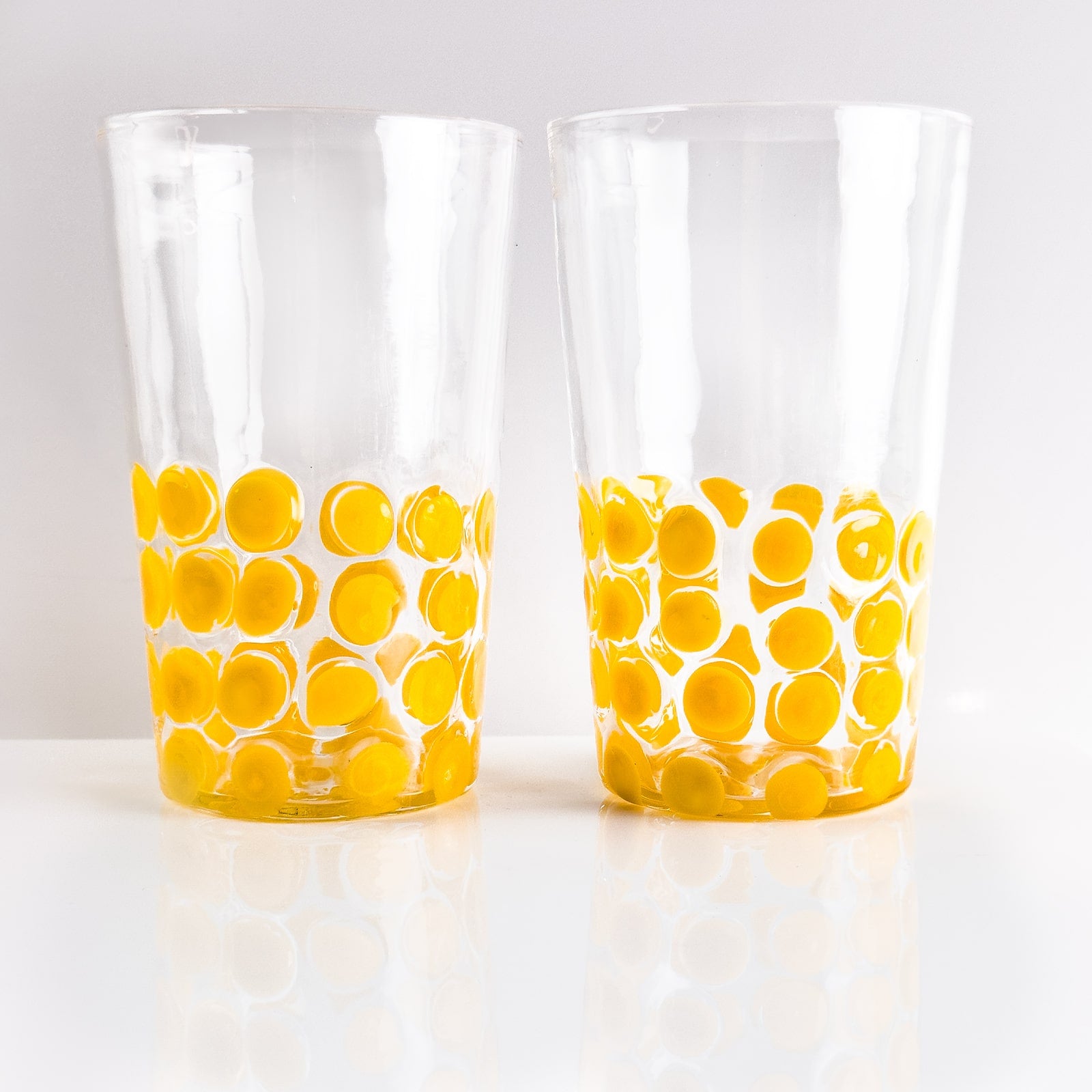 Set of 2 Italian wine glass tumblers by My Italian Decor with dot pattern, clear glass, perfect for serving wine.