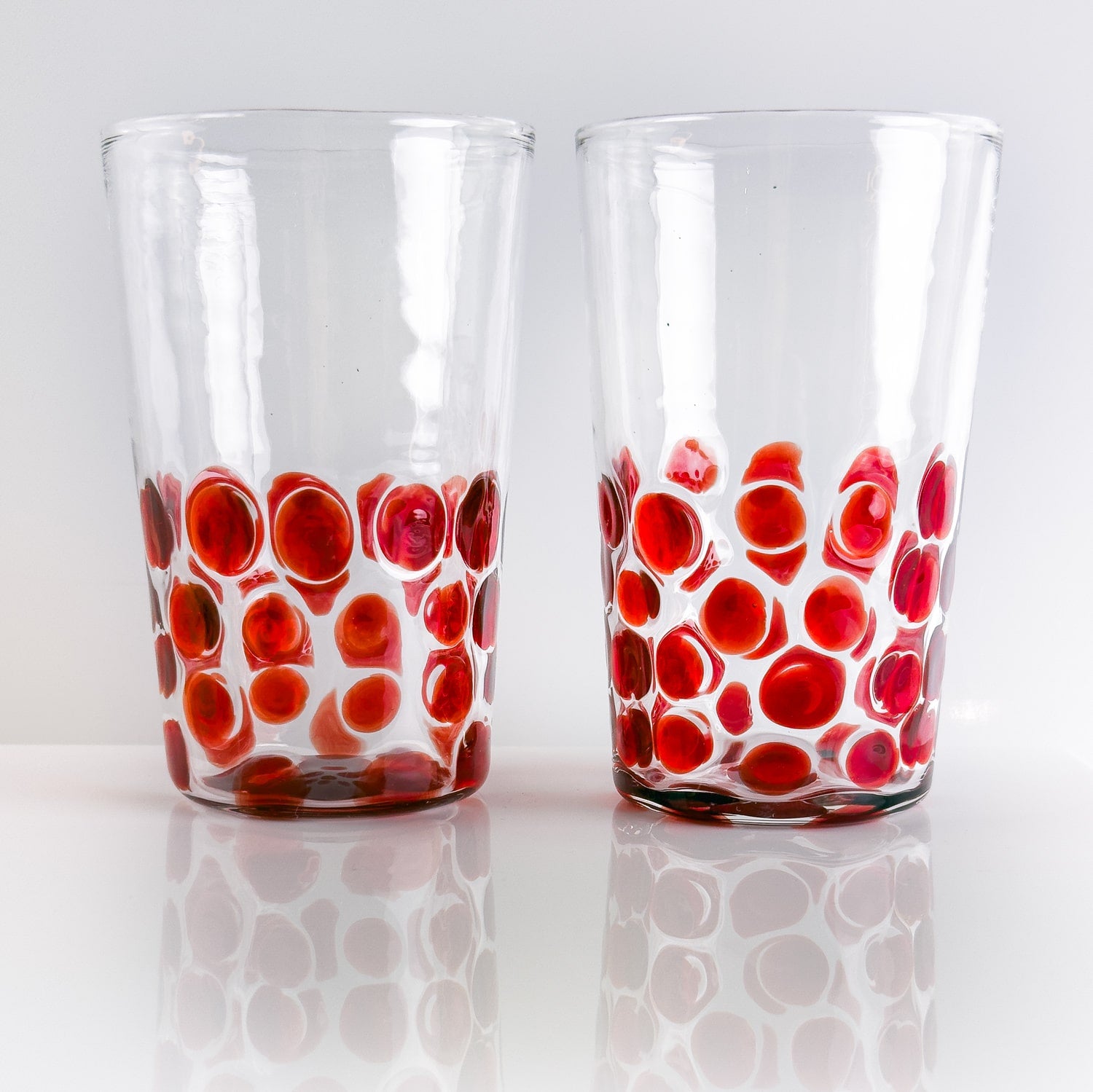 Set of 2 Italian wine glass tumblers with dotted design by My Italian Decor, made in Italy, featuring clear glass and elegant shape.