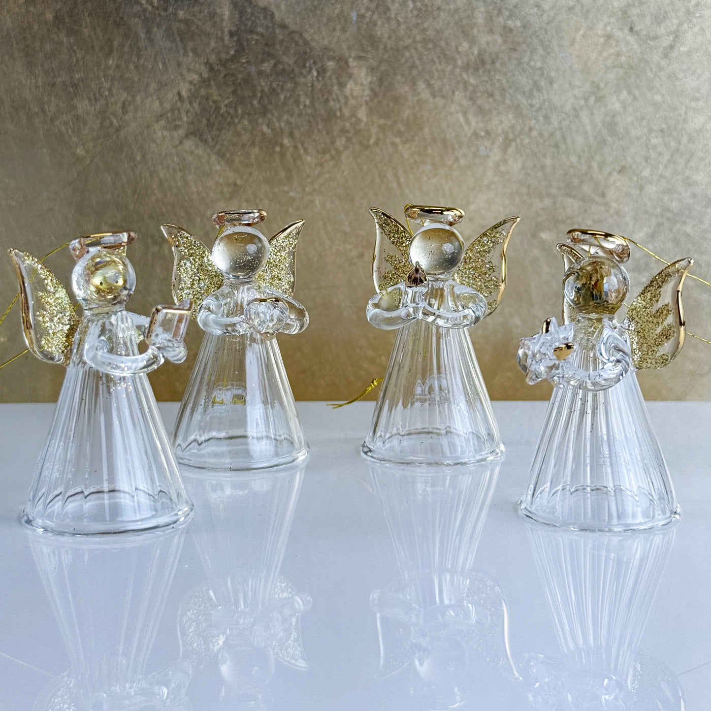 Set of four blown glass angel ornaments by My Italian Decor, featuring delicate craftsmanship for holiday decorations.