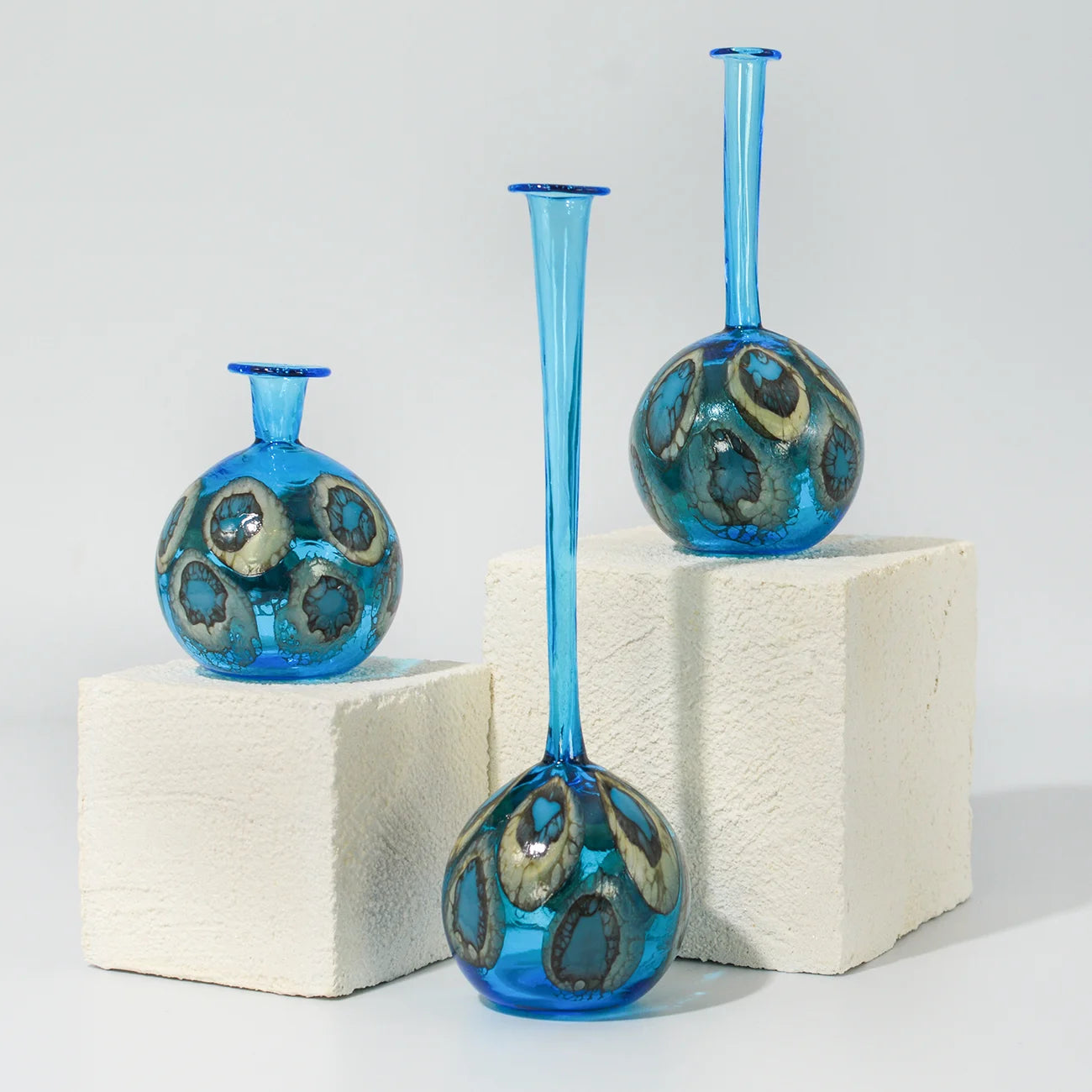 Decorative Murano glass peacock-shaped bottle vase with intricate design, ideal for elegant home decor.