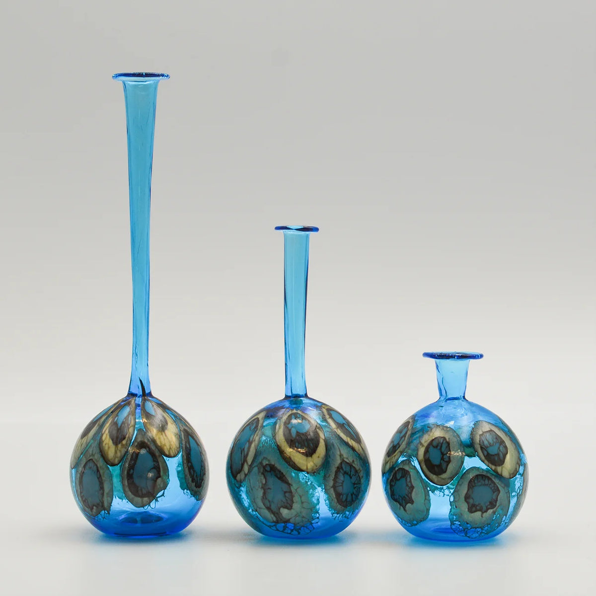 Elegant Murano glass peacock-shaped decorative bottle and bud vase by My Italian Decor, showcasing vibrant colors and intricate design.