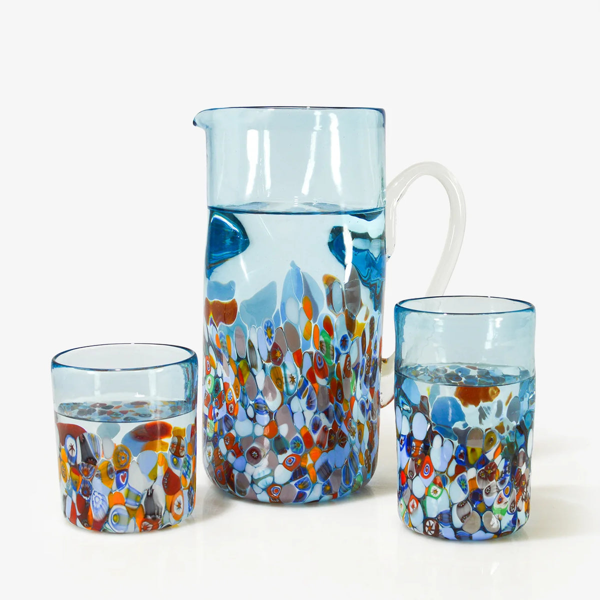 Set of Murano glass drink tumblers and serving pitcher from DZ's San Marco Collection, featuring colorful, handcrafted Murano glass design.