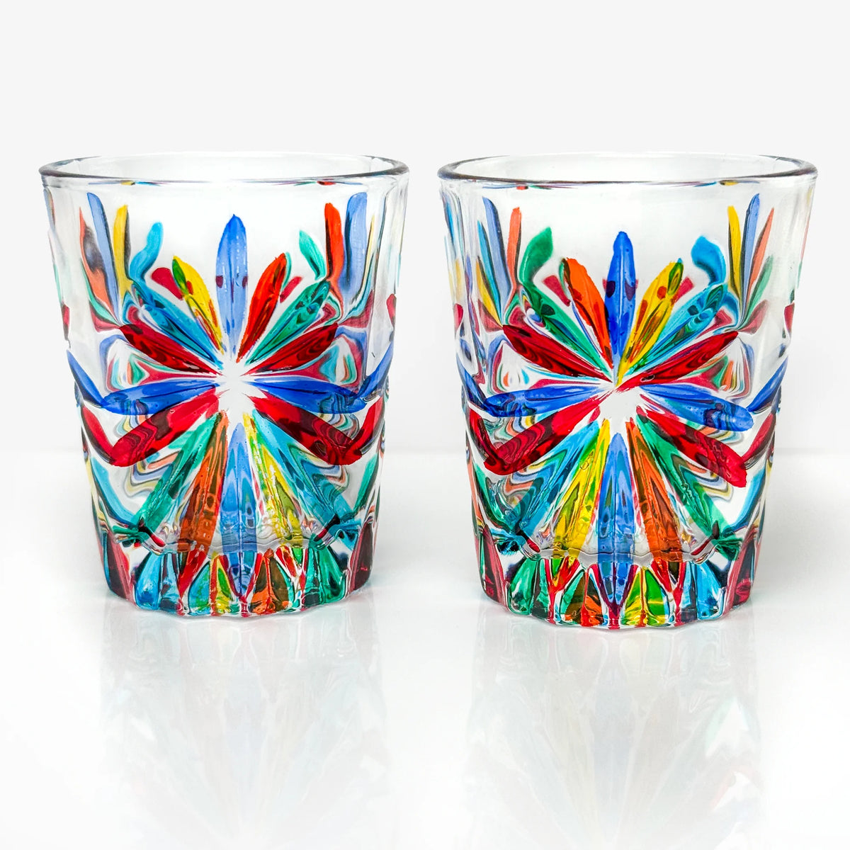 Set of six Italian crystal shot glasses with starburst design by MyItalianDecor, showcasing elegant, clear glass craftsmanship.