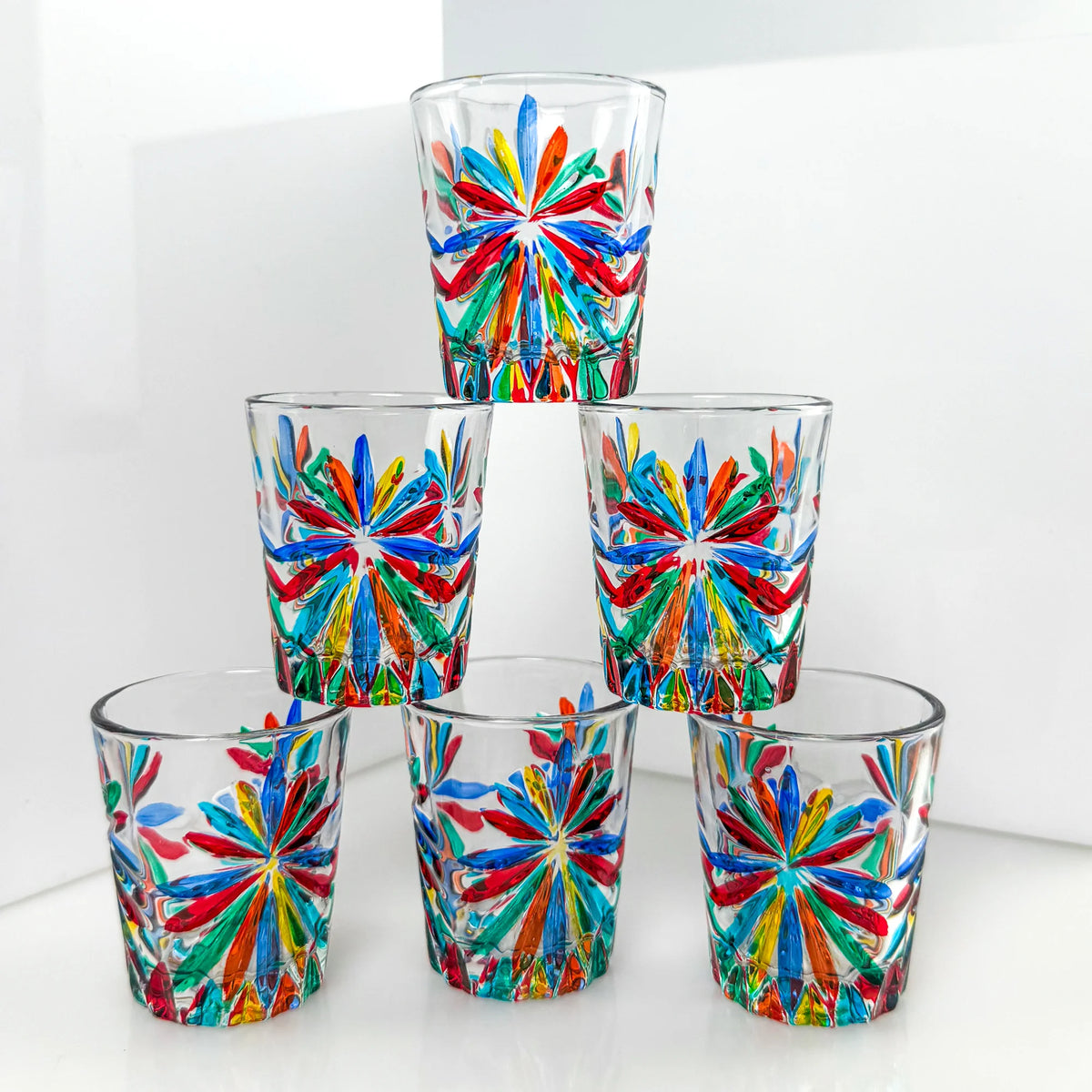 Set of six Italian crystal shot glasses with starburst design, made in Italy, by MyItalianDecor, showcasing clear, elegant glassware.
