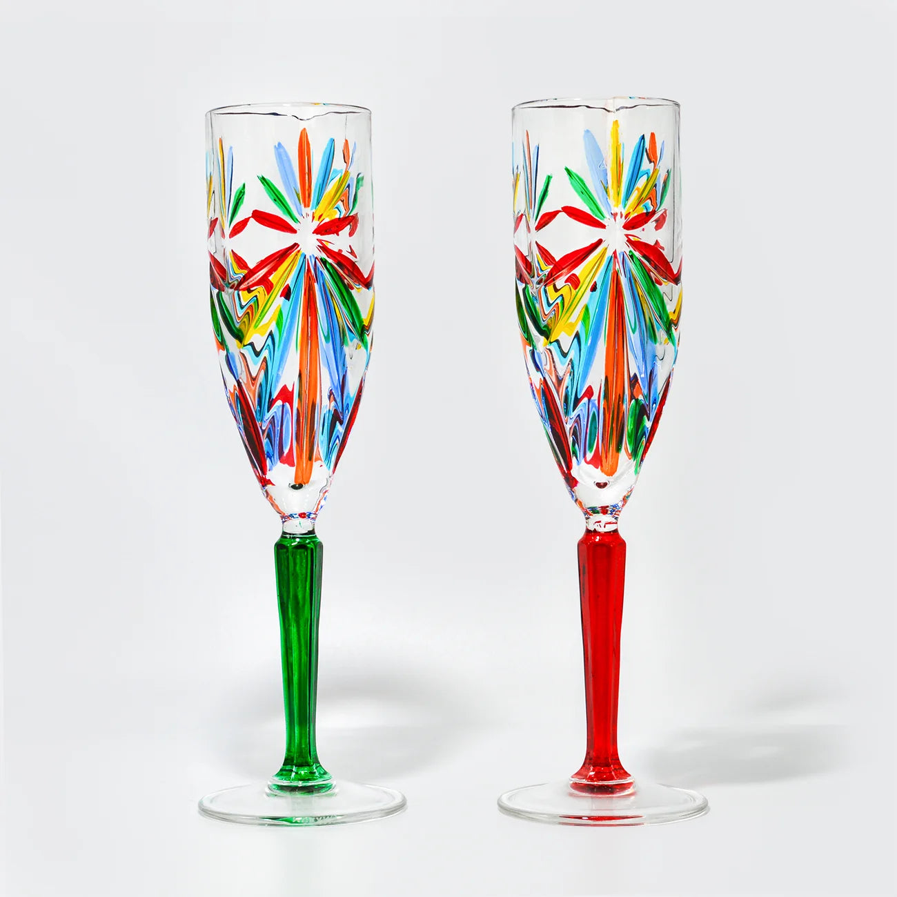 Set of two DZ Starburst Champagne Flutes with multicolored starburst design, made in Italy, elegant glassware for celebrations.