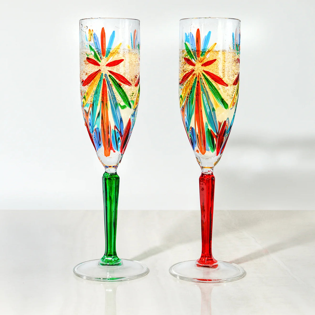 Set of two DZ Starburst Champagne Flutes with a modern multi-faceted design, made in Italy, featuring elegant glassware for celebratory toasts.