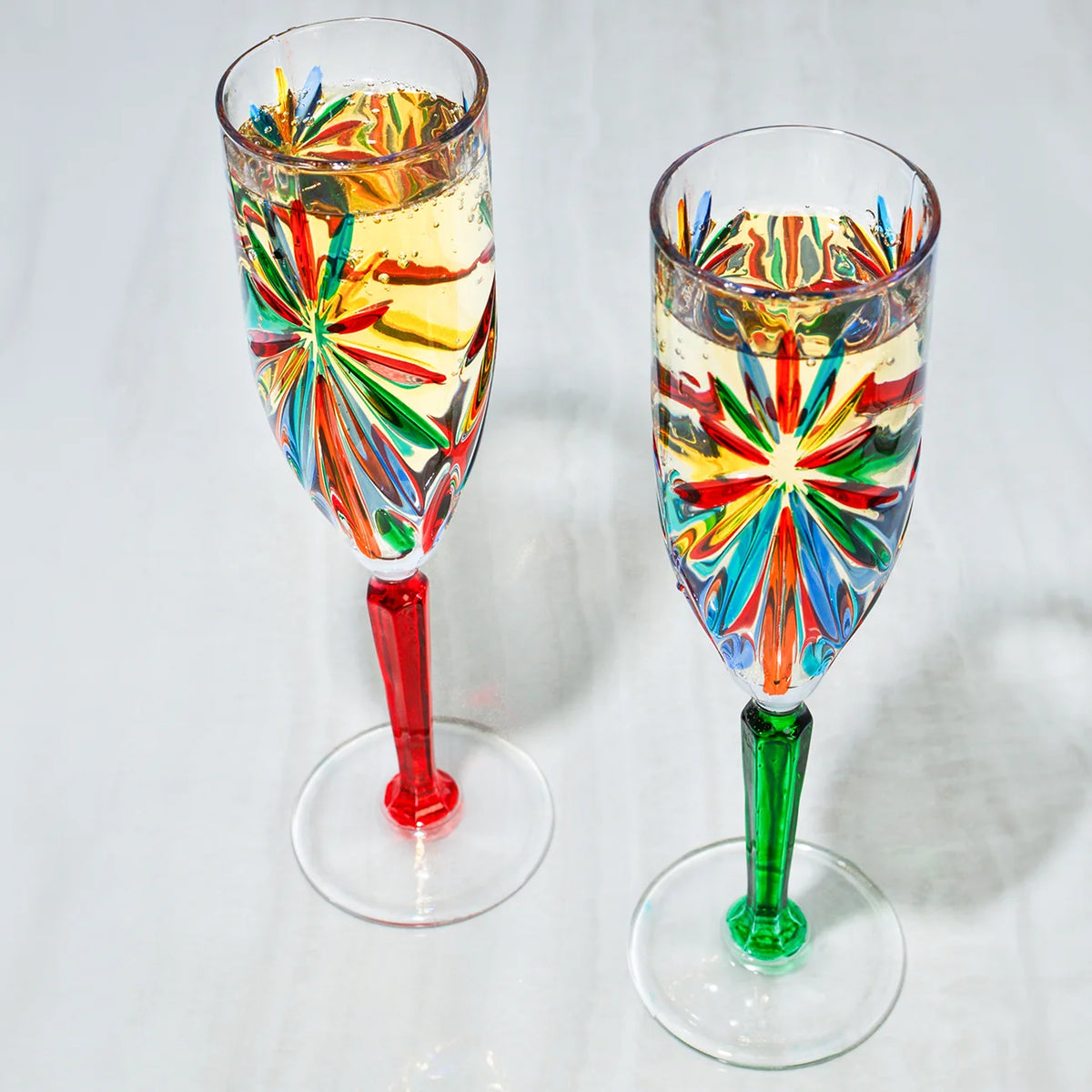 Pair of DZ Starburst champagne glasses in multi-colored design, made in Italy, elegant and stylish for special occasions