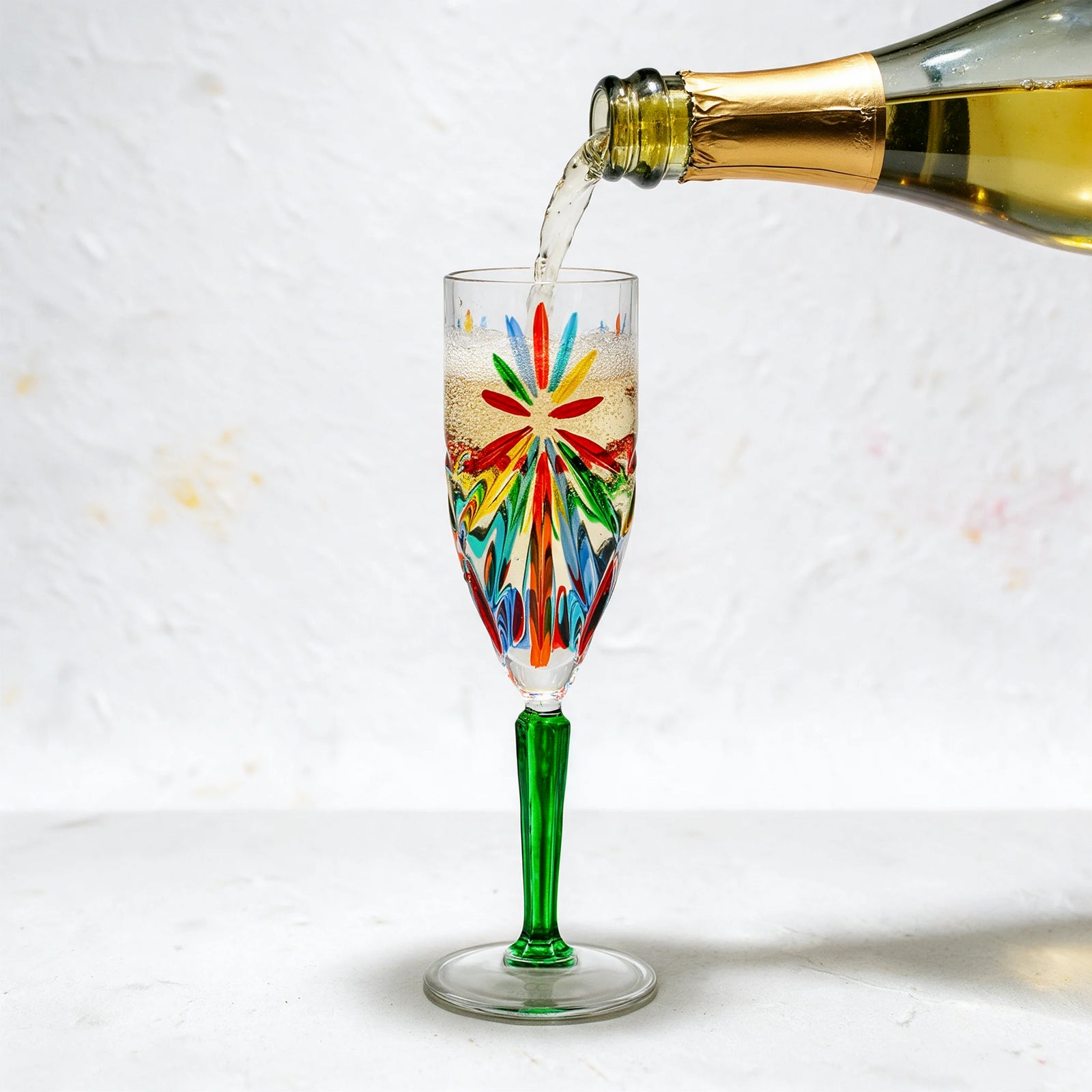 Set of two DZ Starburst Champagne Flutes with multicolored starburst design, made in Italy, elegant glassware for celebrations.