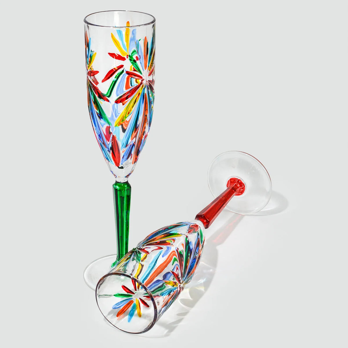 Set of two DZ Starburst champagne glasses with a modern design, made in Italy, perfect for celebratory drinks.