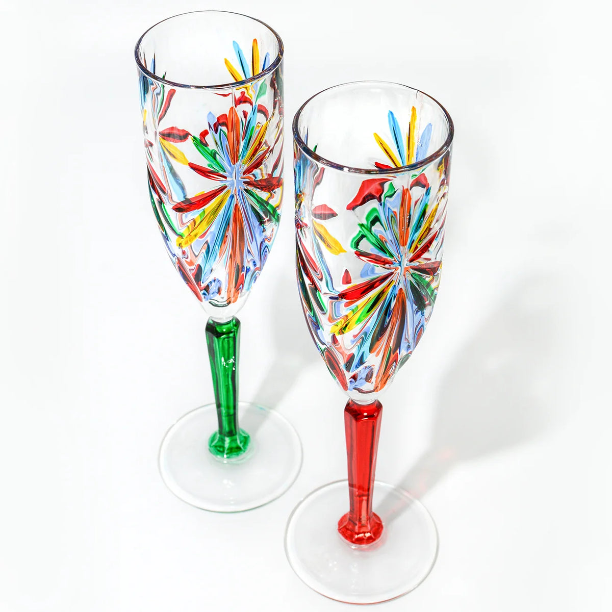 Pair of DZ Starburst Champagne flutes with a modern multi-faceted design, made in Italy, for elegant celebrations.