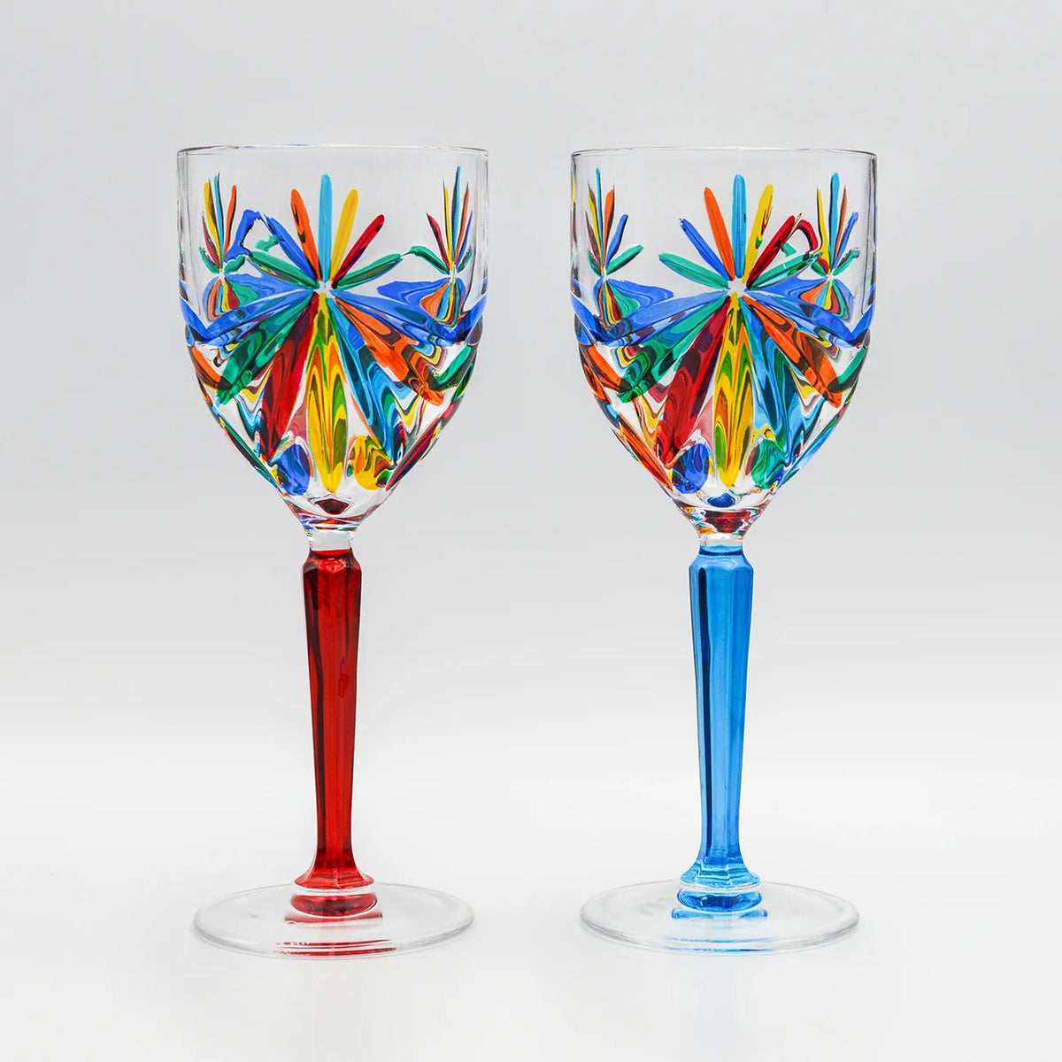 Set of two DZ starburst design hand-painted Italian crystal wine glasses showing intricate patterns and elegant shapes.
