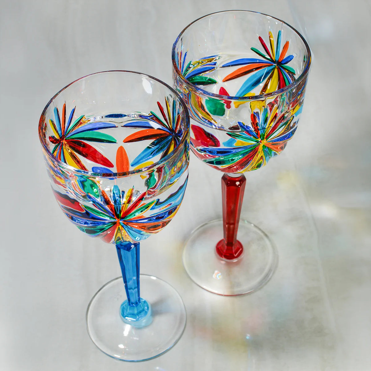 Set of two DZ Starburst wine glasses, hand-painted Italian crystal goblets with intricate starburst design, elegant and decorative.