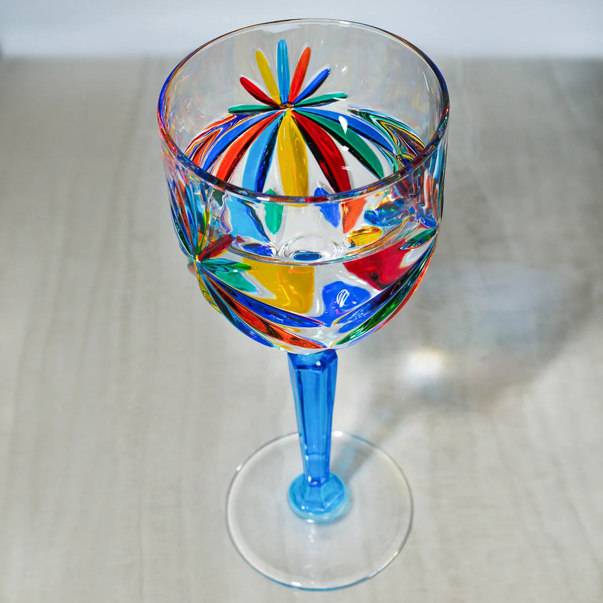 Two hand-painted Italian crystal starburst wine glasses by DZ, elegant and decorative for special occasions or everyday use.