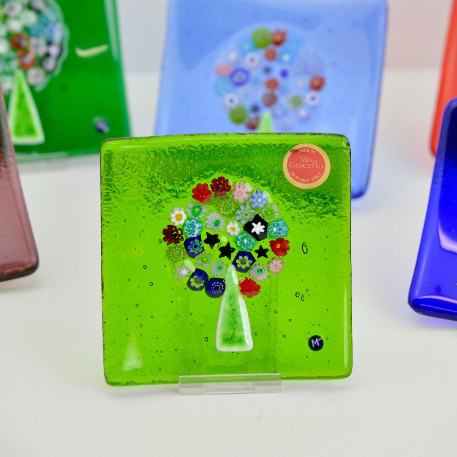 Cobalt Murano glass Millefiori Tree of Life catch-all dish, 4-inch flat decorative tray with colorful floral patterns.