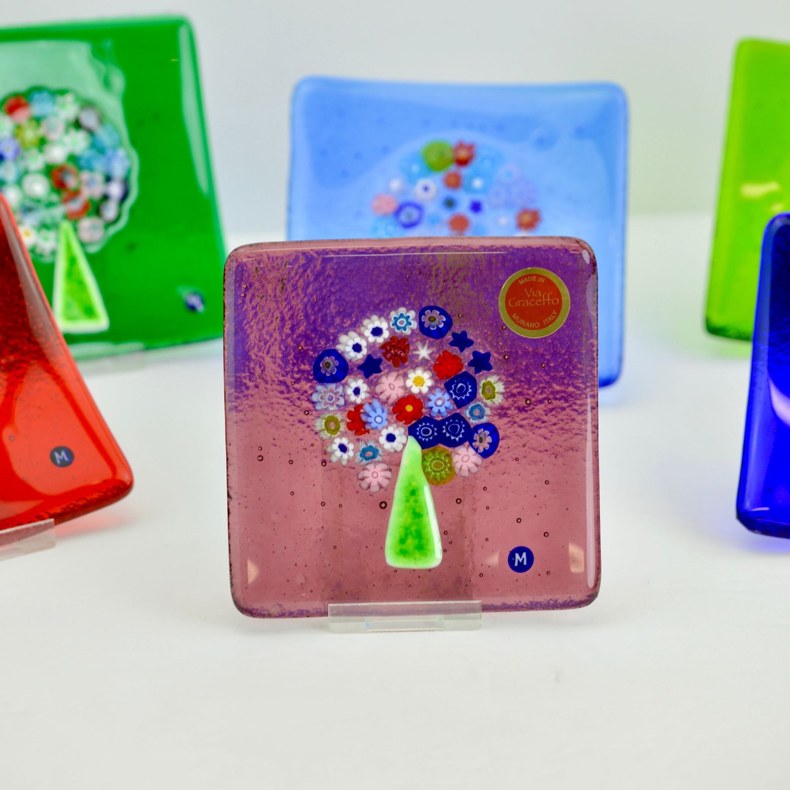 Cobalt Murano glass Millefiori Tree of Life catch-all dish, 4-inch flat decorative tray with colorful floral patterns.