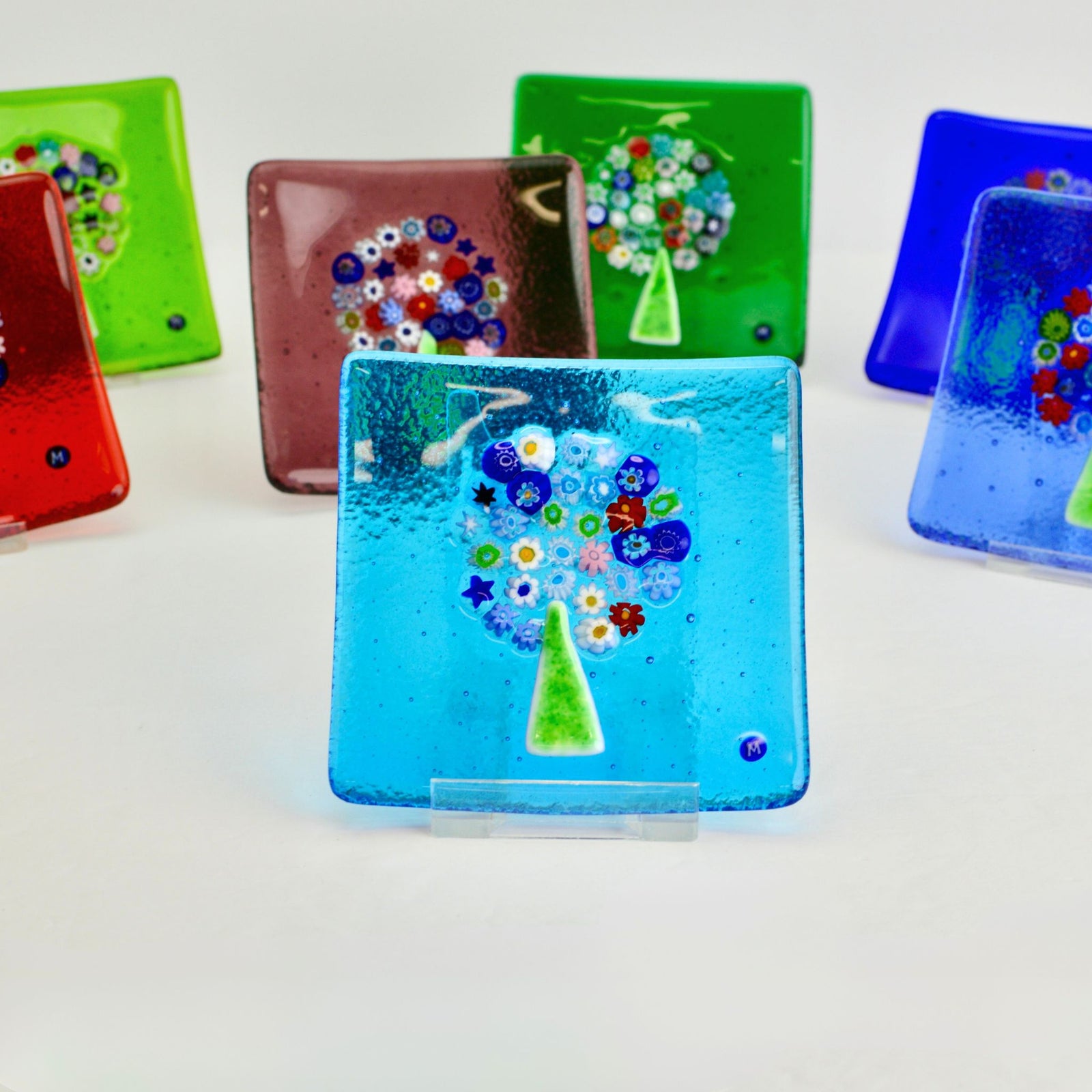 Cobalt Murano glass Millefiori Tree of Life catch-all dish, 4-inch flat decorative tray with colorful floral patterns.