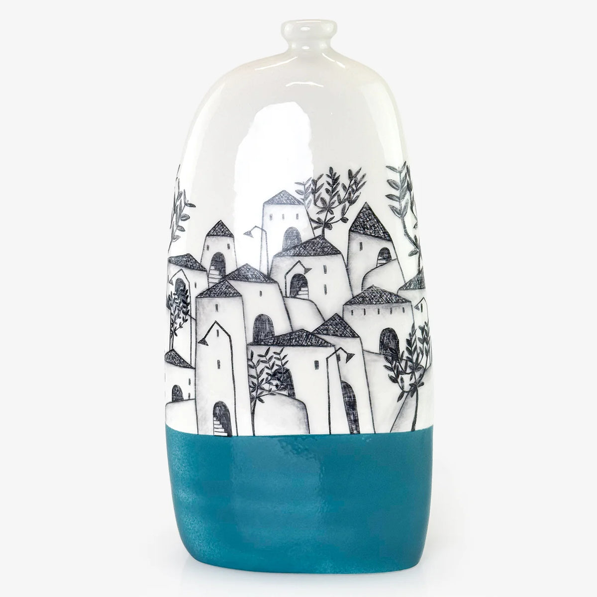 A ceramic vase with a glossy finish, featuring a hand-painted black and white illustration of Mediterranean-style houses and trees, with a solid teal blue base.