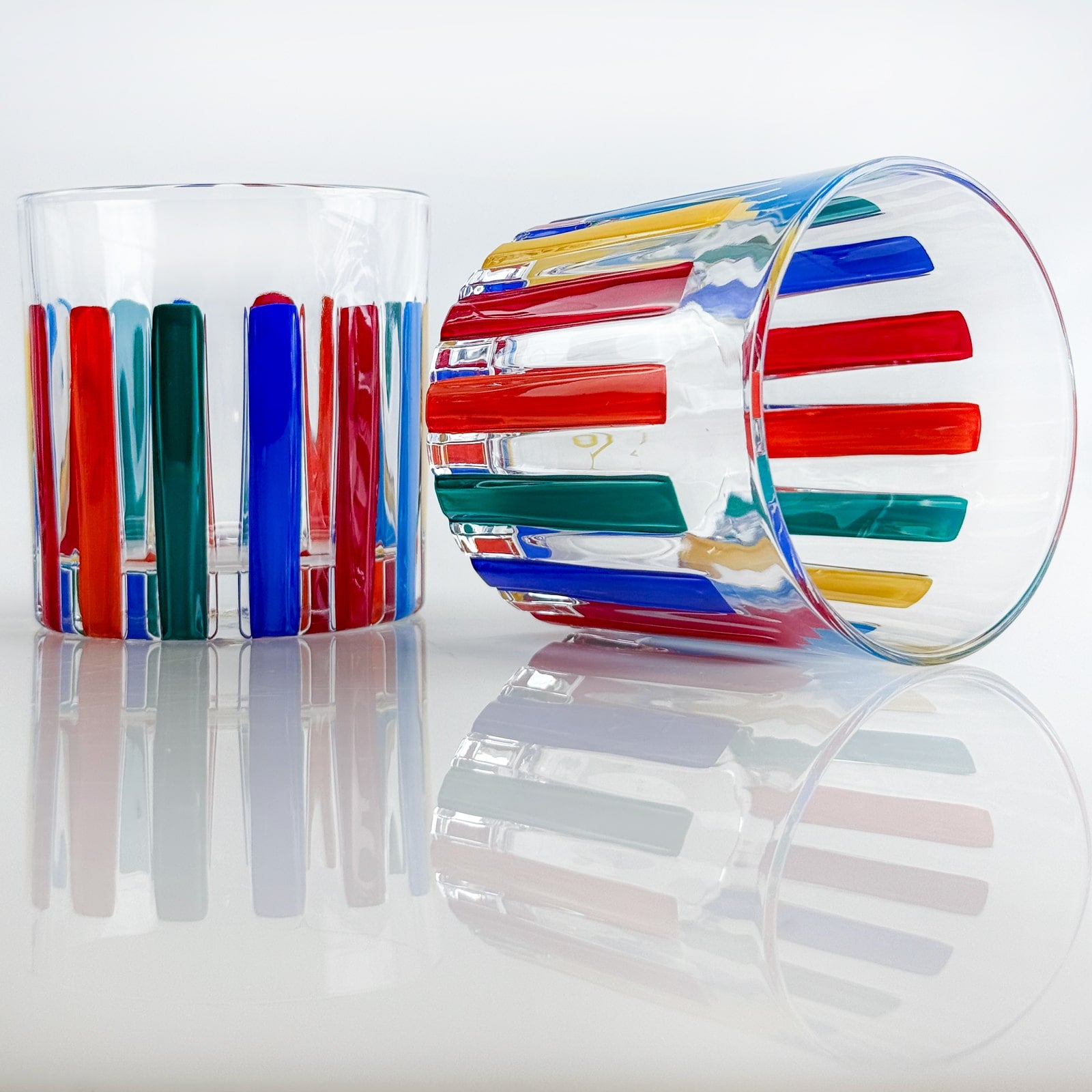 Set of 2 DZ crystal short tumblers with multicolor opaque glass, featuring a sleek, modern design for serving beverages.