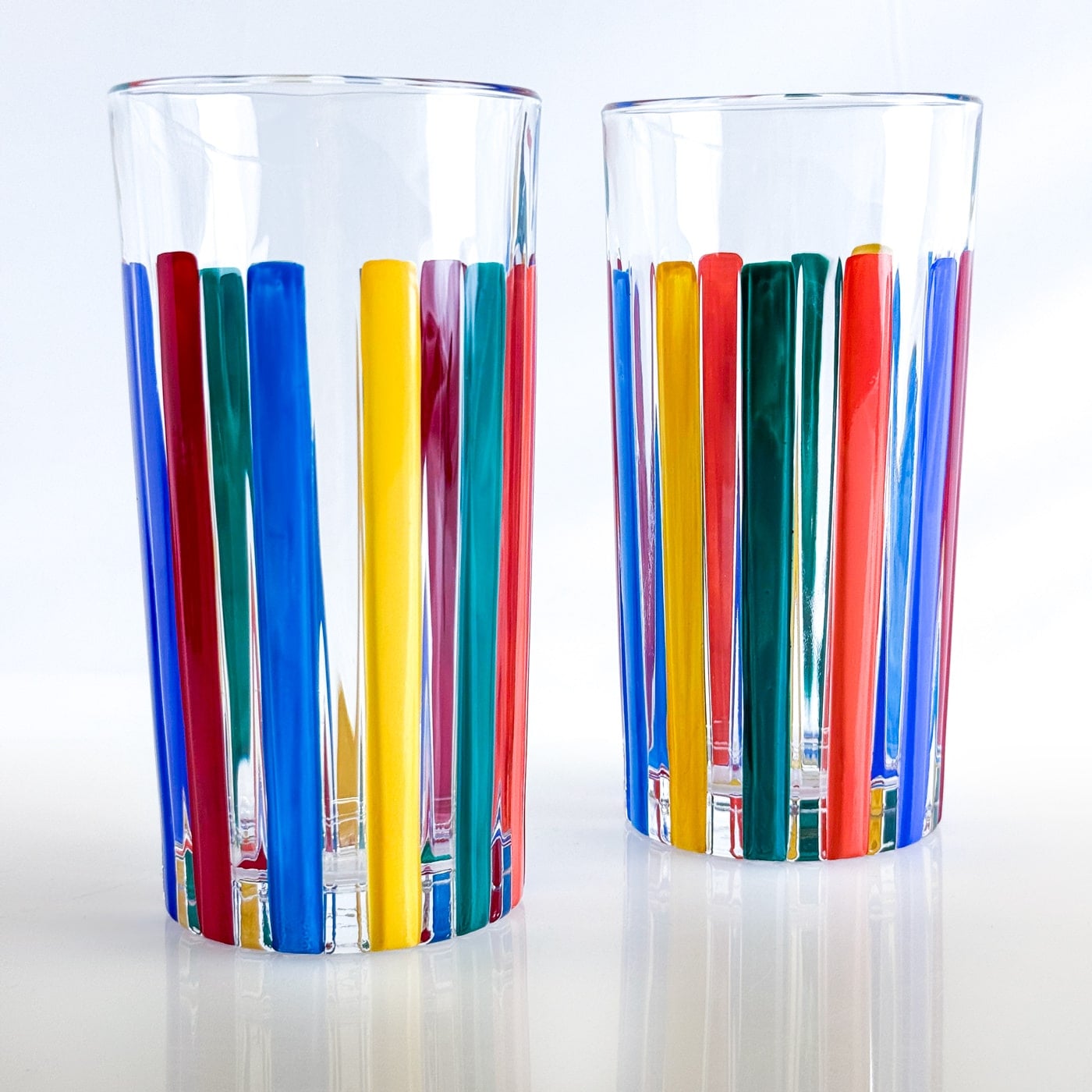 Set of 2 DZ crystal highball tumblers with multicolor opaque design, featuring sleek, modern drink glasses for stylish serving.