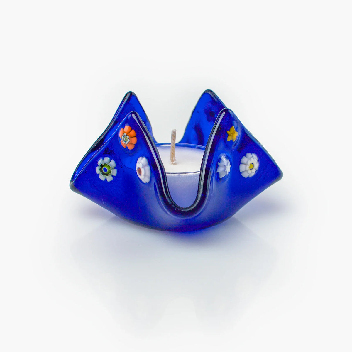 Colorful Murano glass Millefiori candle votive holder on a decorative tray, handcrafted in Italy with intricate floral patterns.