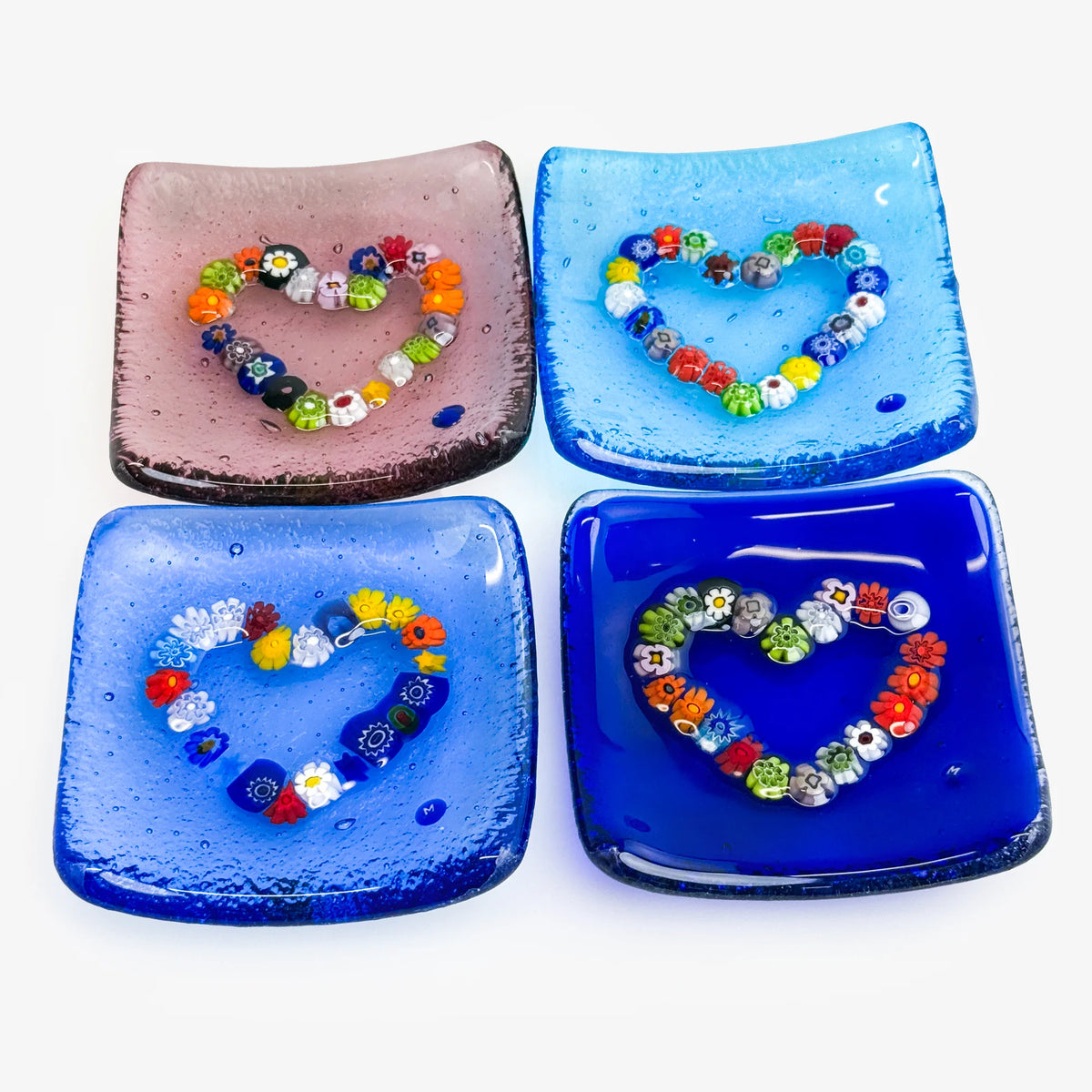 Decorative Murano glass heart-shaped dish with Millefiori pattern, 3.25 inches, used as a catch-all or jewelry tray.