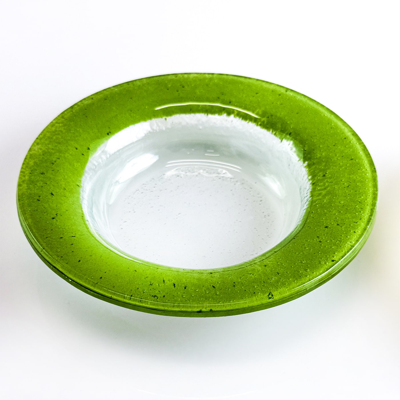 Stack of glass bowls in colorful shades on a white background