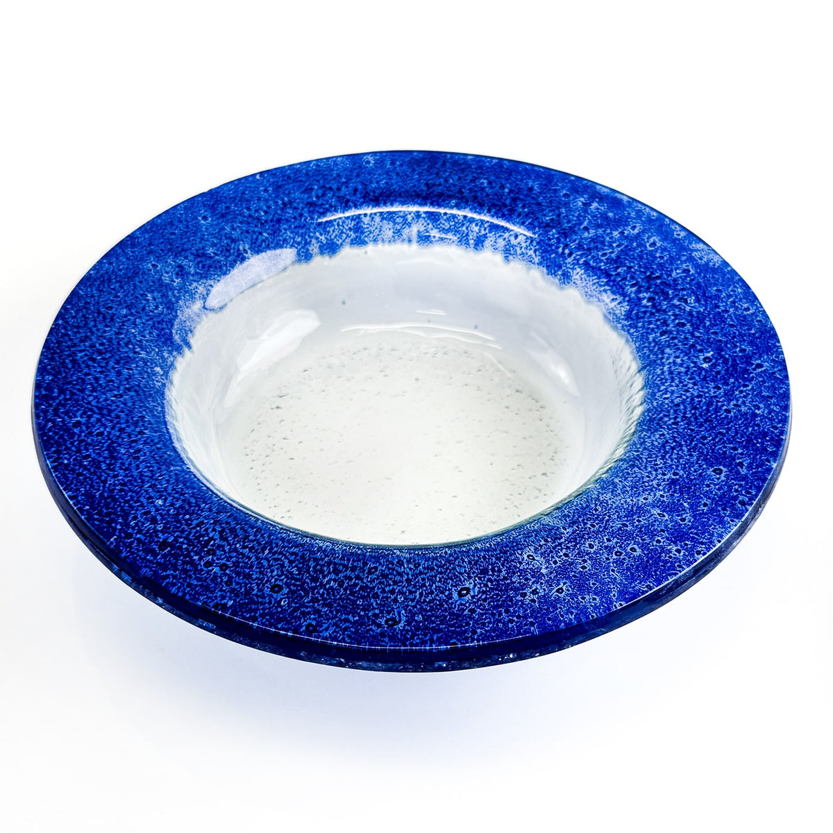 Blue glass bowl  on a white background