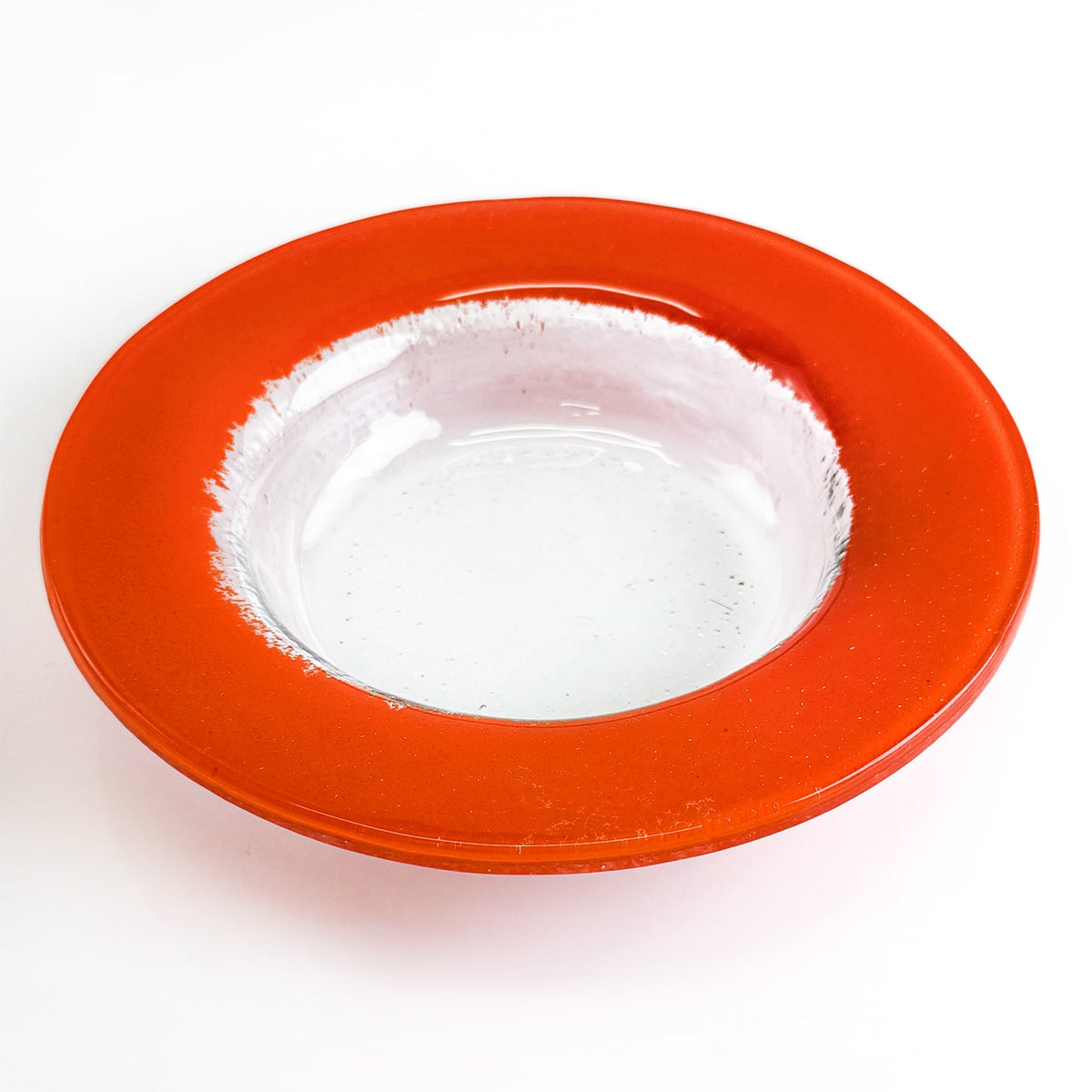 Red glass bowl on a white background