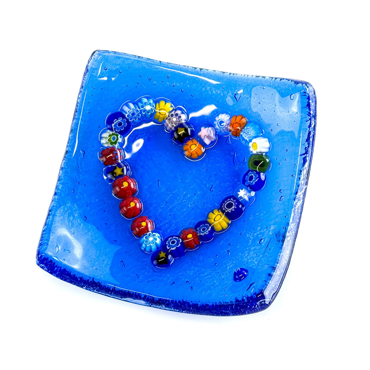 Decorative Murano glass heart-shaped dish with colorful millefiori patterns, 4-inch catch-all tray for jewelry or small items.