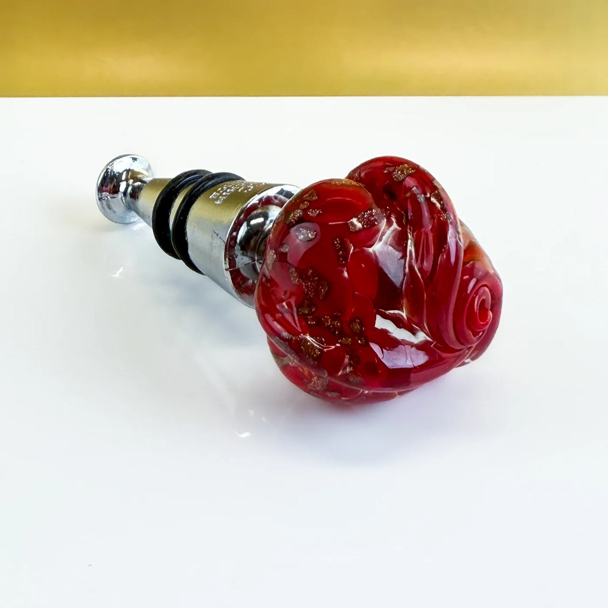 Murano glass wine stopper in rose style with elegant pink glass design, perfect for preserving wine bottles.