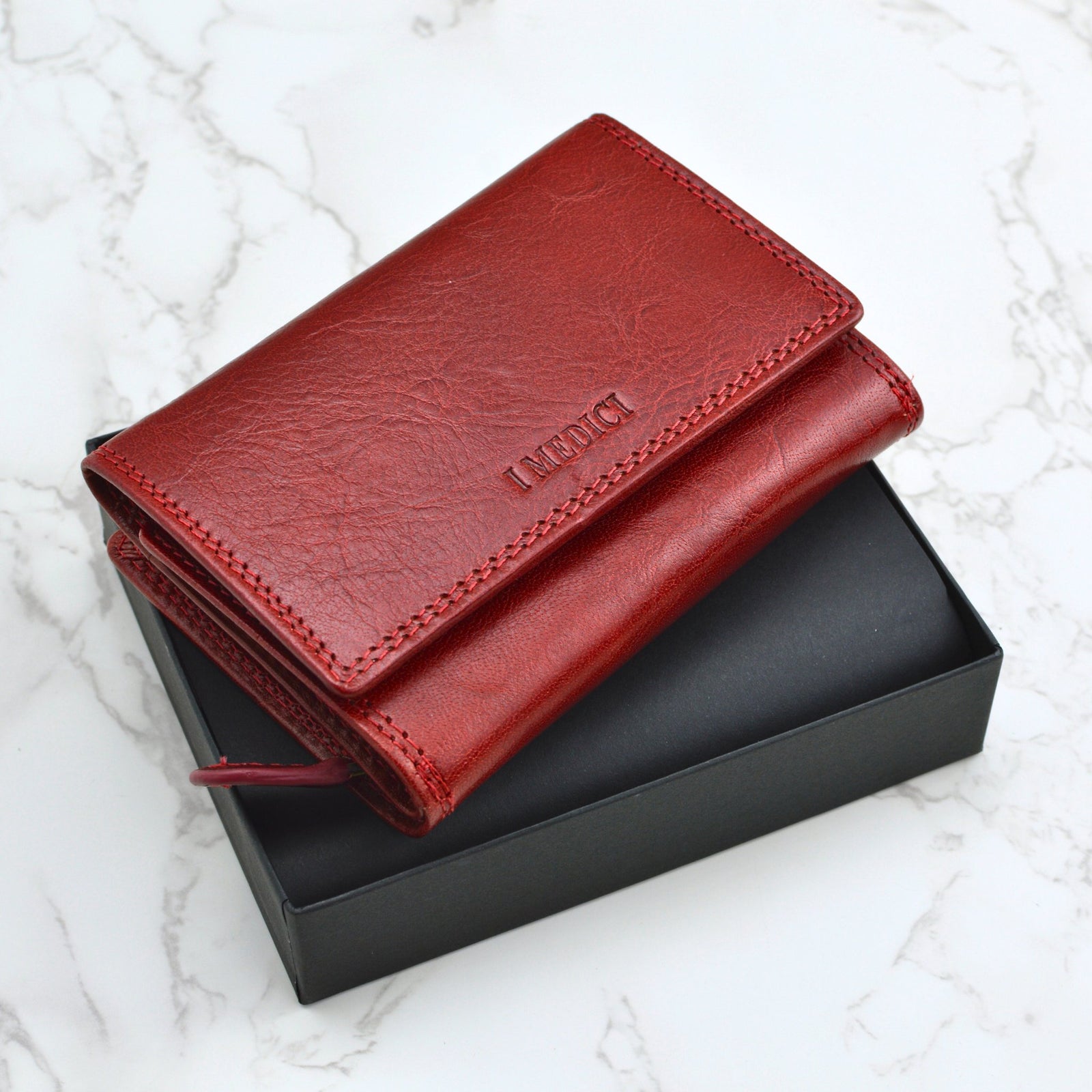 Colorful Gemma Women's Tri-fold Italian leather wallet from MyItalianDecor, showing multiple wallets stacked in various shades.