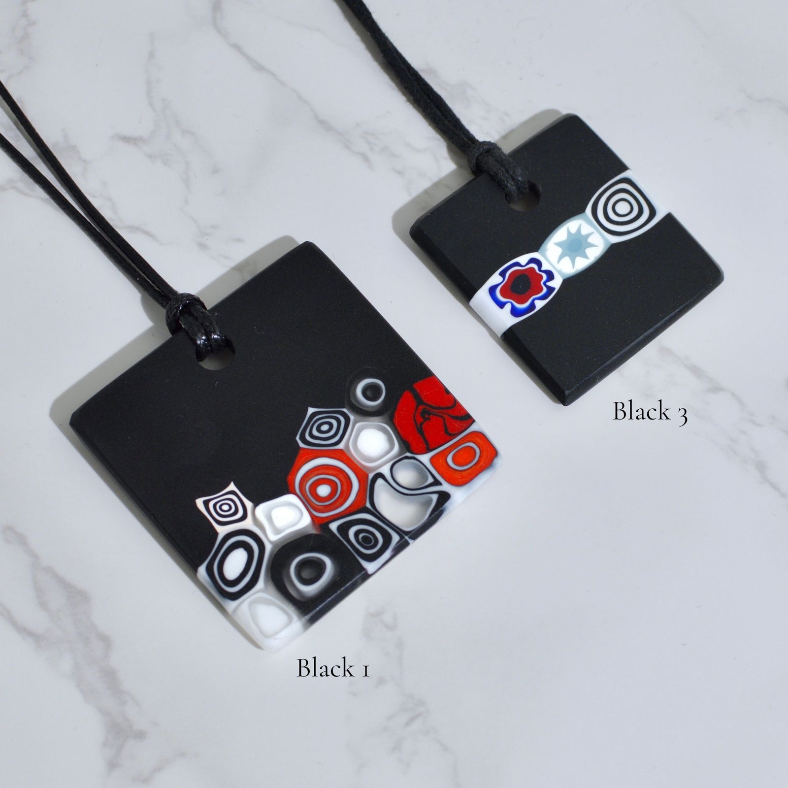 Square black glass pendant necklace with colorful millefiori design, made in Italy, by My Italian Decor.