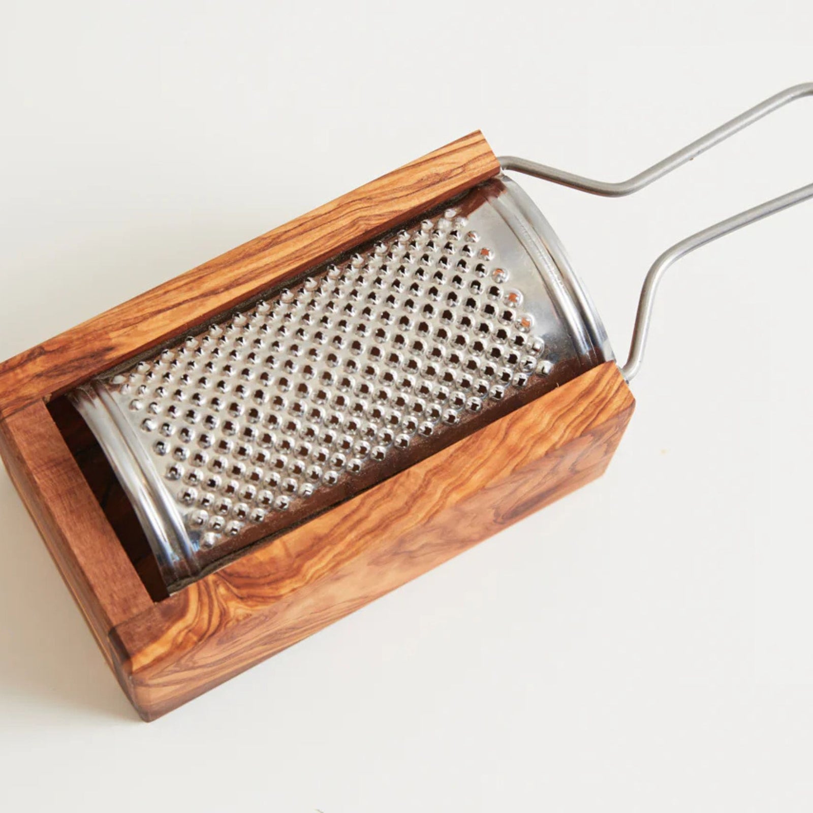 My Italian Decor olivewood Parmesan cheese grater with ergonomic handle and stainless steel grating surface.