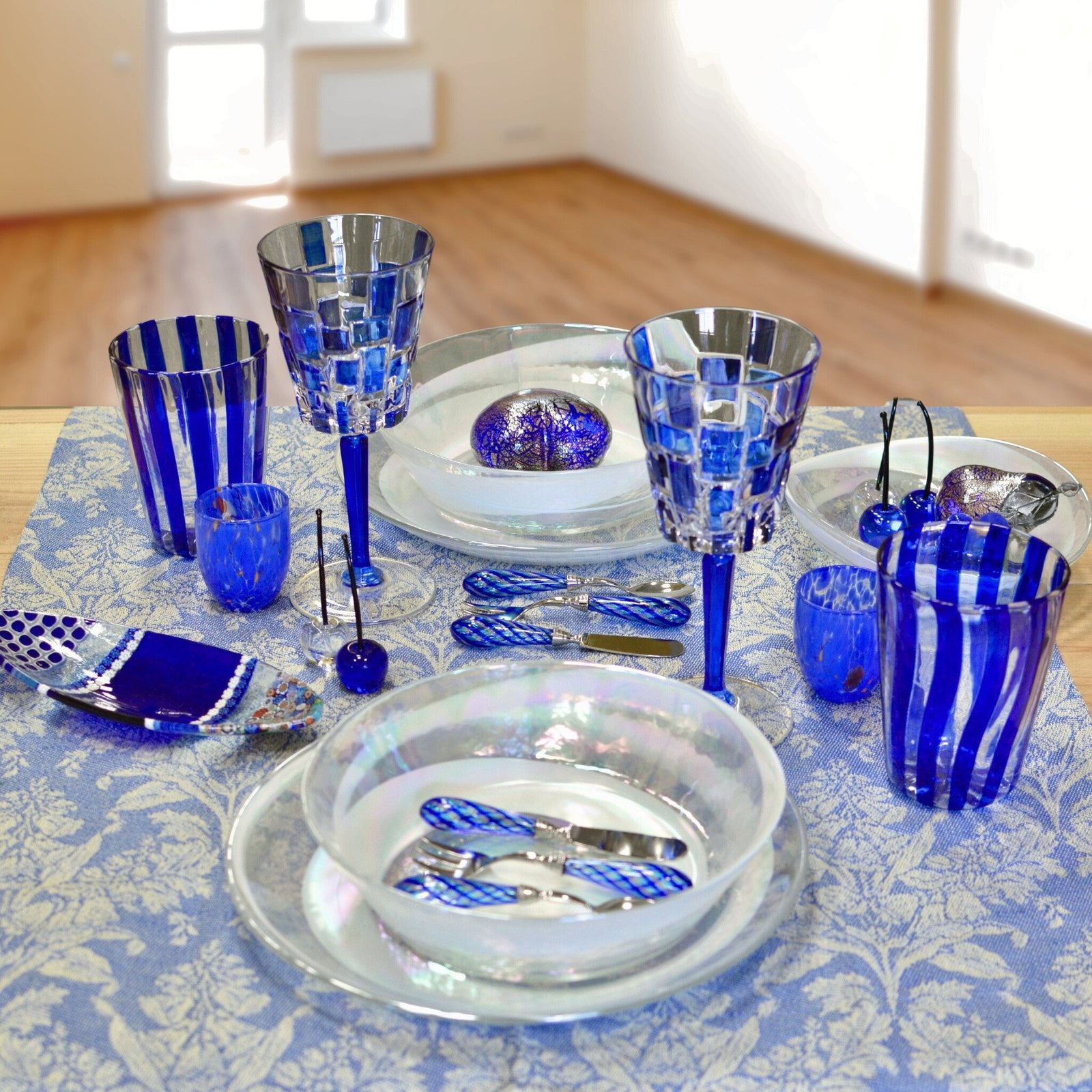 Two DZ Etna hand-painted Italian crystal wine glasses in sapphire blue, set of 2, with elegant curved design.