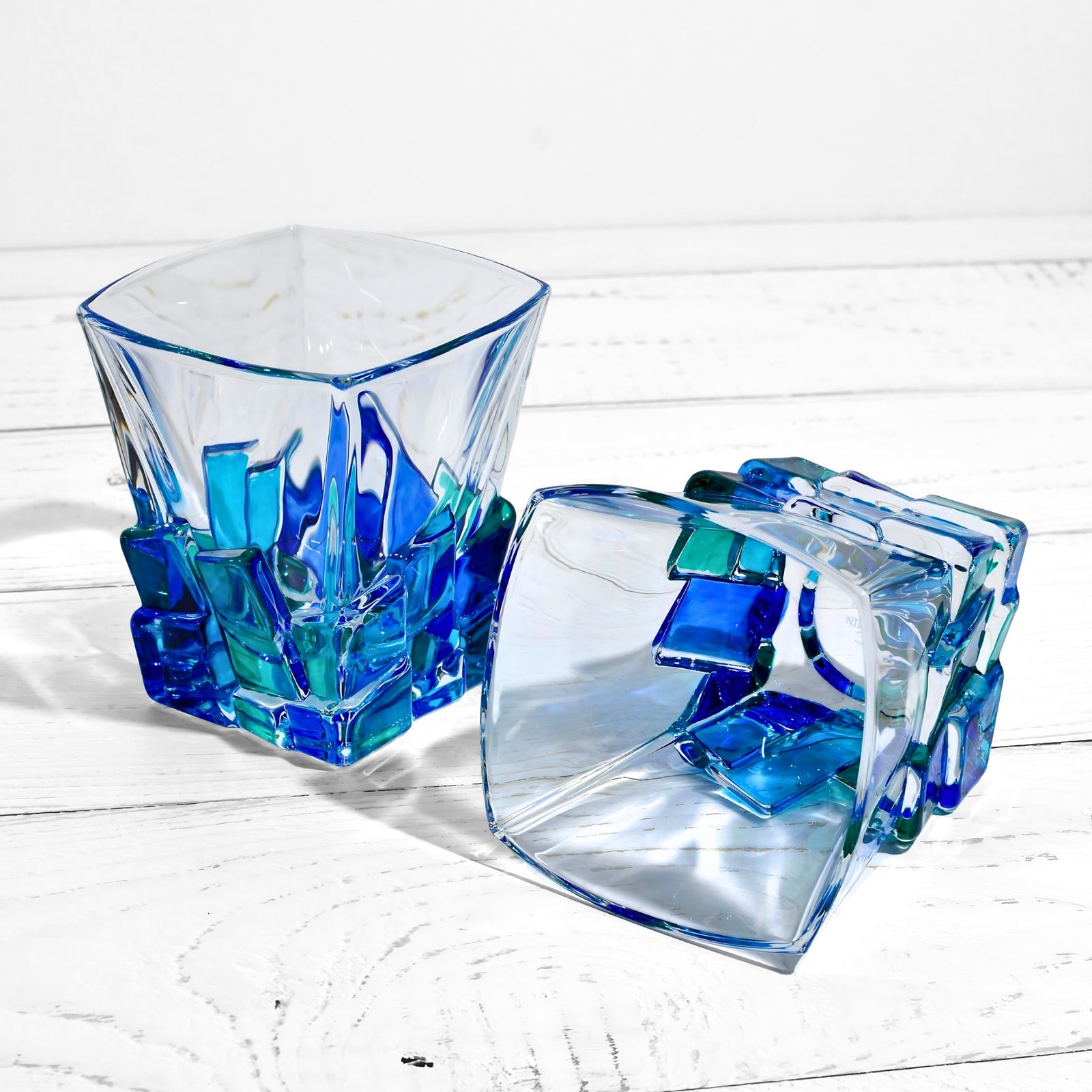 Set of two DZ Crack Short Drink Tumblers in blue and green glass with a crack design, ideal for whiskey or spirits.