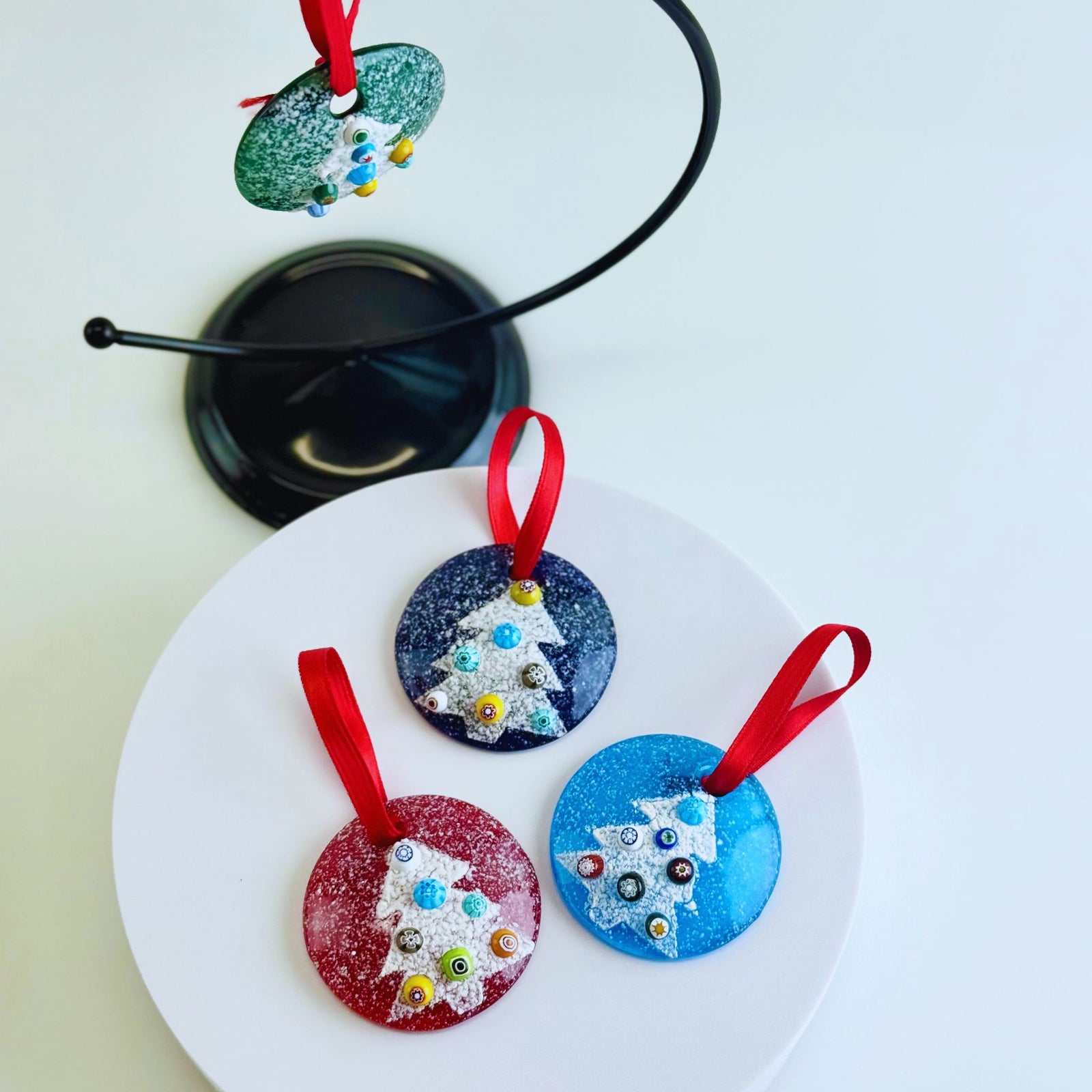 Group of mini glass disc ornaments featuring colorful millefiori designs, ideal for holiday decor from My Italian Decor.