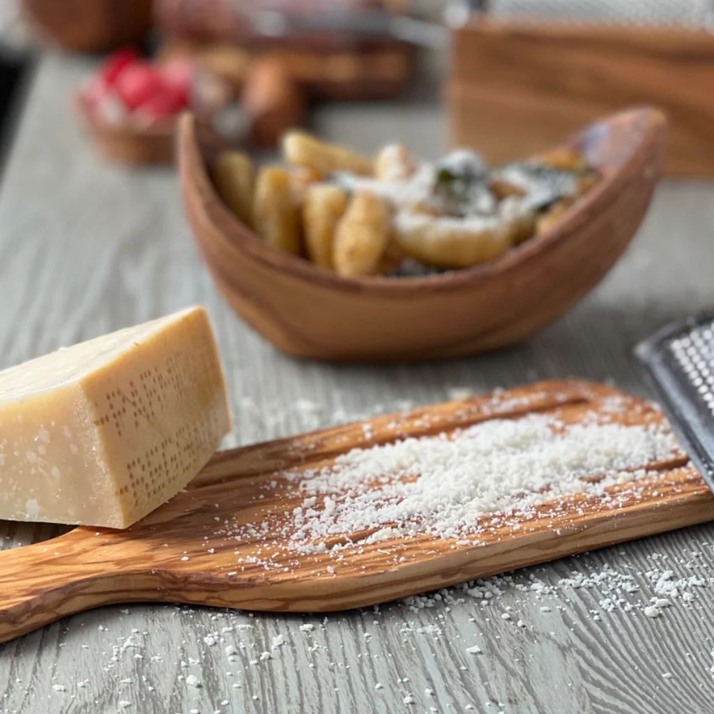 My Italian Decor olivewood flat cheese grater with Italian craftsmanship, showcasing a sleek, rectangular grater surface on a flat cheese board.