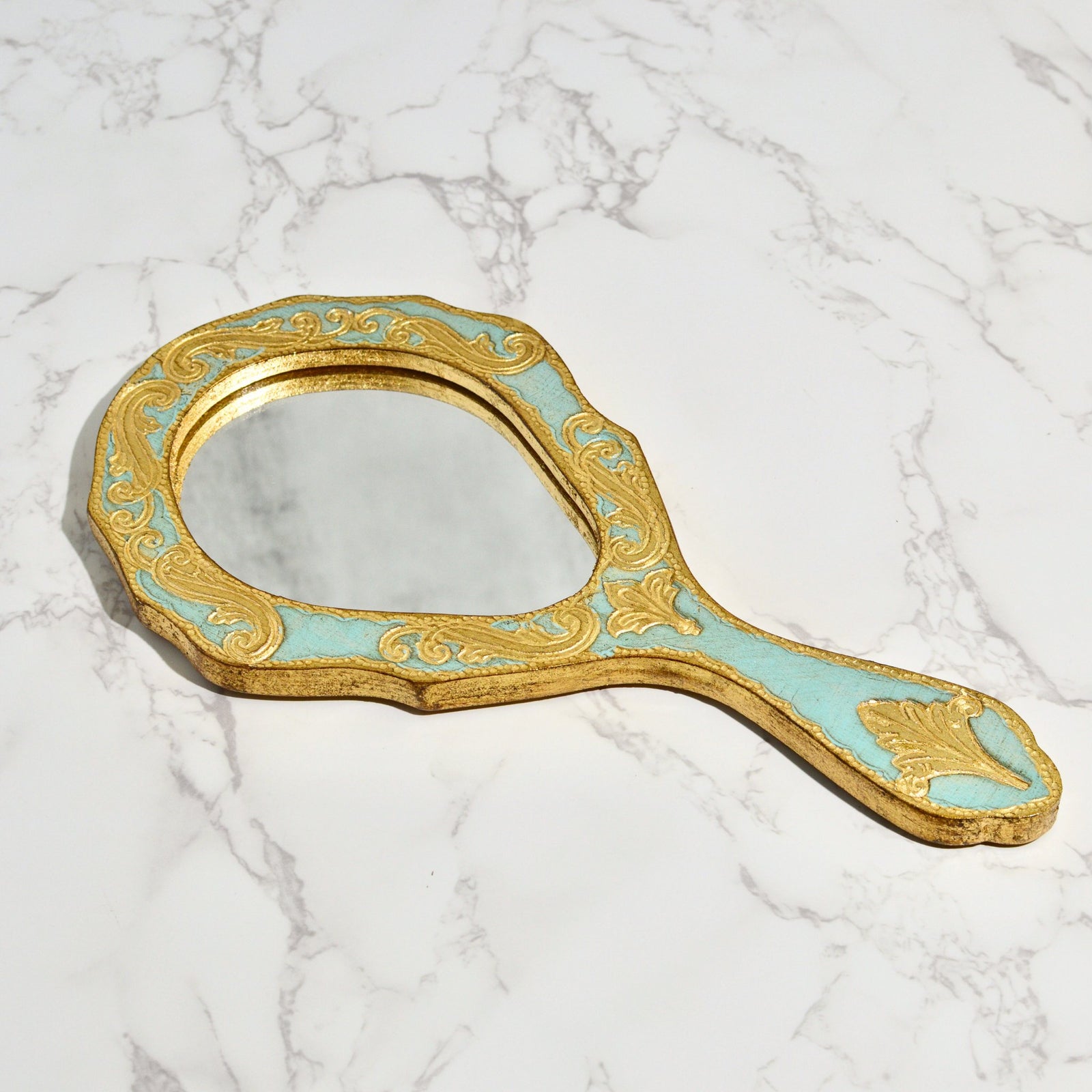 Florentine wood oval hand mirror with intricate design, made in Italy, by My Italian Decor, featuring a polished wooden frame.