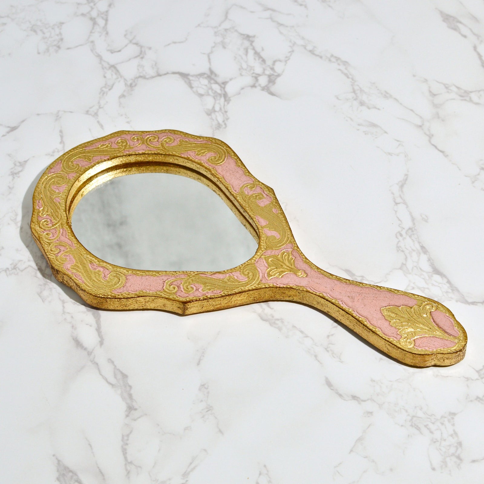 Florentine wood oval hand mirror with intricate design, made in Italy, by My Italian Decor, featuring a polished wooden frame.