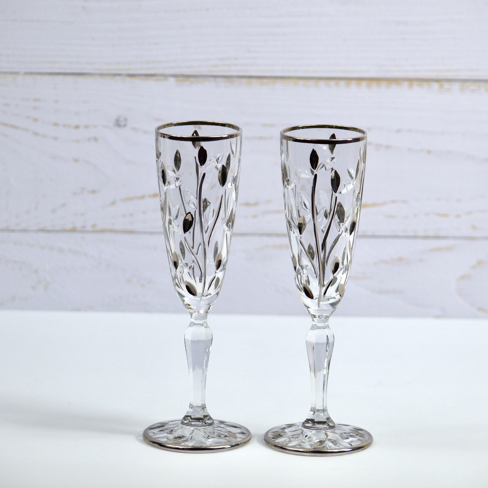 Two DZ Flowervine Platinum Champagne Glasses with elegant floral design, set of 2, showcasing clear glass with platinum accents.