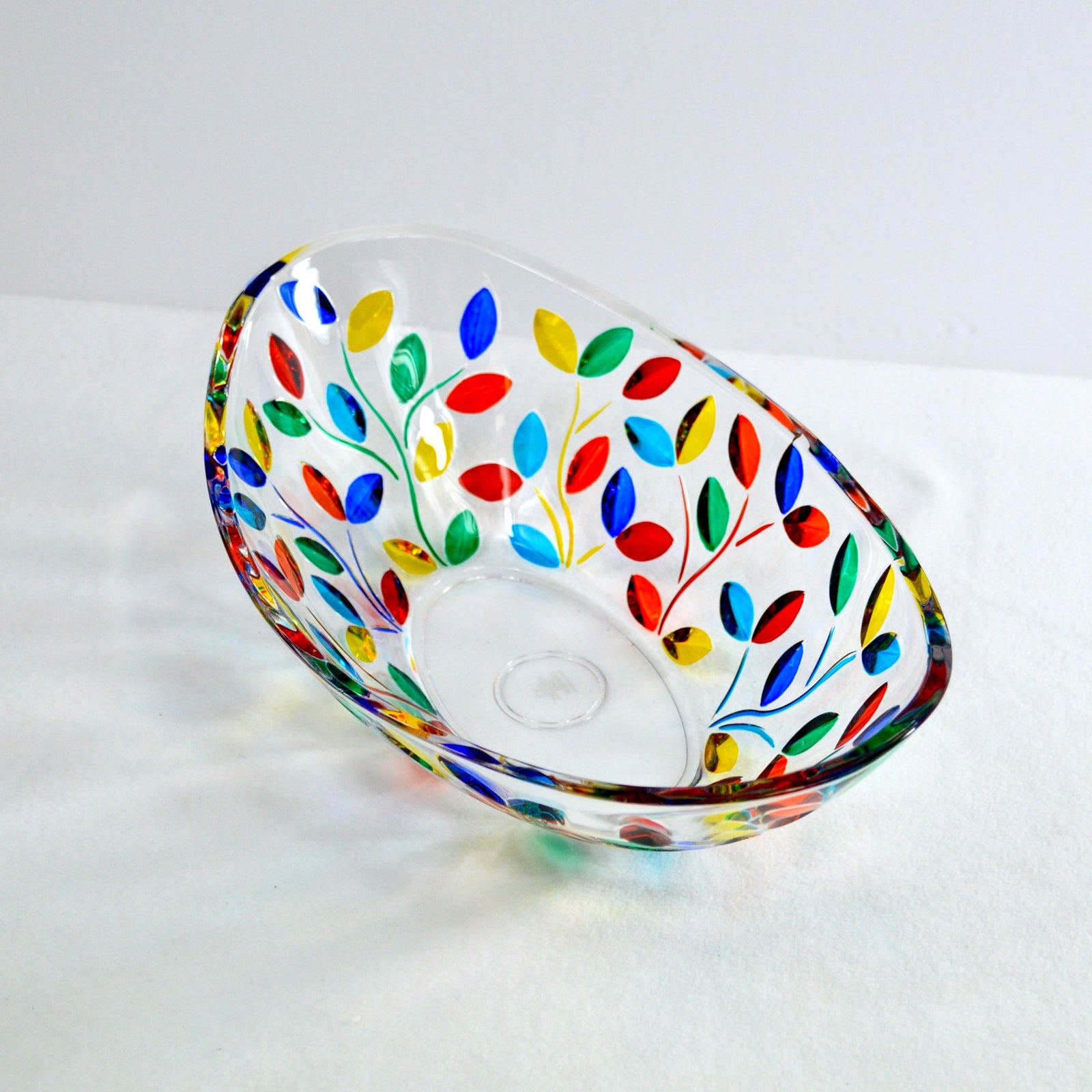 Handmade DZ Flowervine oval glass bowl with painted floral design, viewed from a three-quarter angle, decorative Italian ceramic piece.