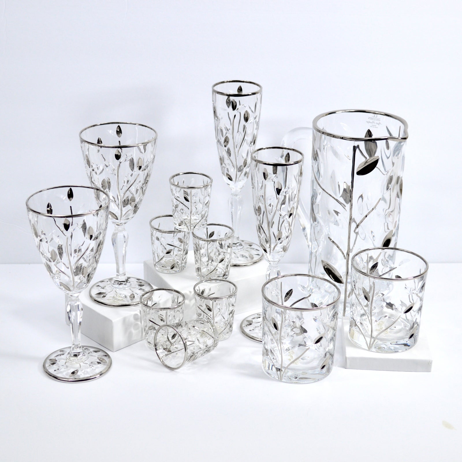 Set of six DZ Italian Crystal Flowervine shot glasses with platinum accents, elegant and decorative for stylish drinking occasions.