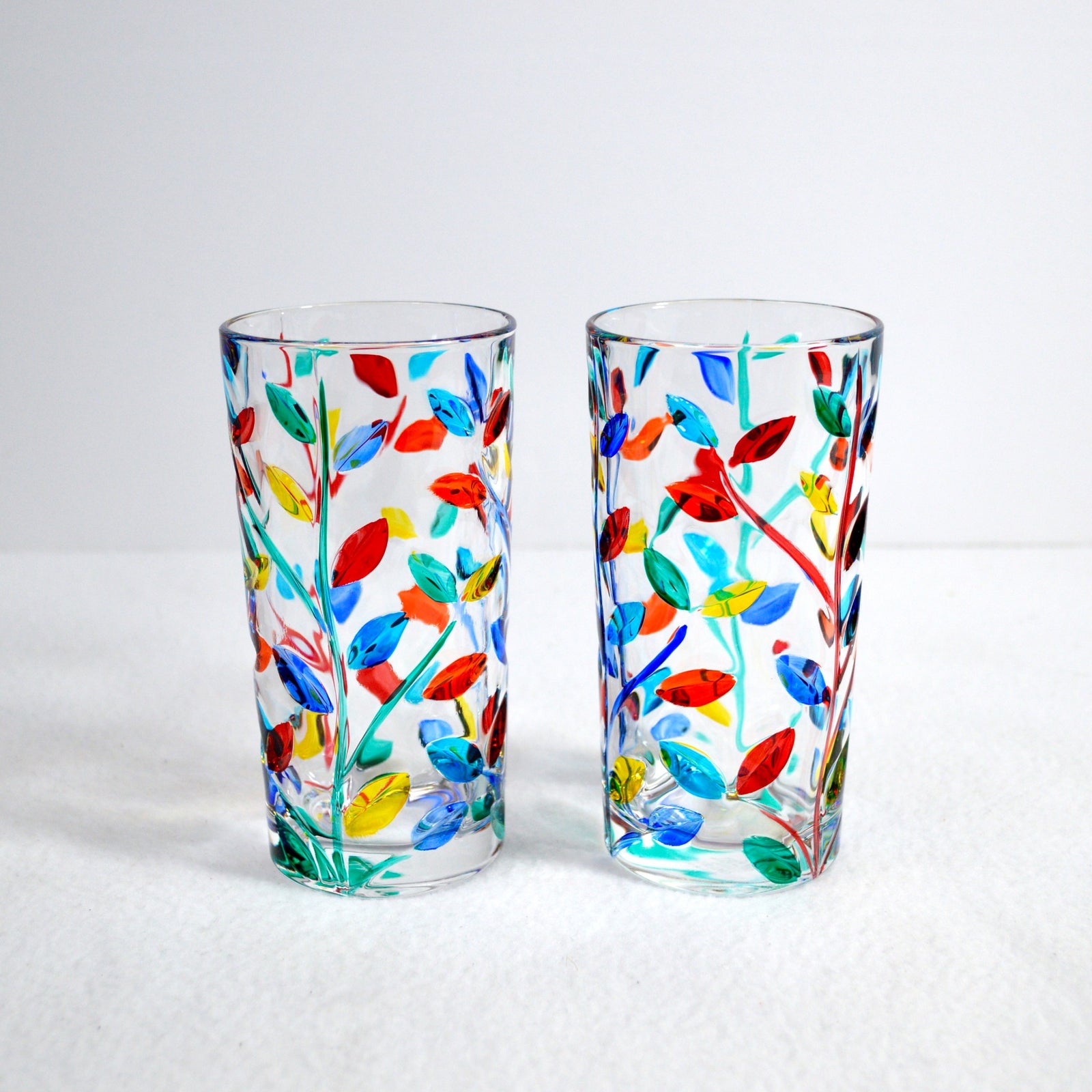 Set of two DZ Flowervine tall drink glasses, hand-painted Italian crystal tumblers with floral vine design and elegant craftsmanship.
