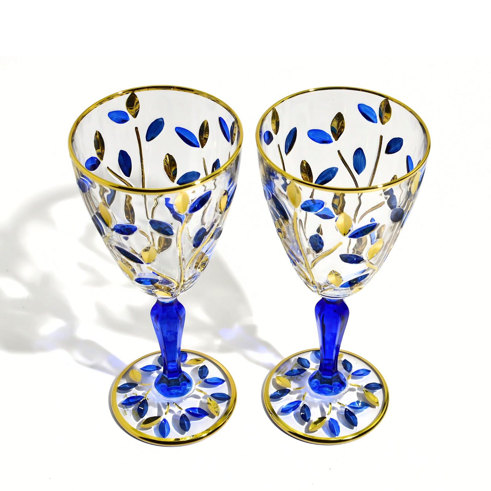 Set of two DZ Flowervine sapphire blue and gold wine glasses with elegant design, perfect for wine serving and special occasions.