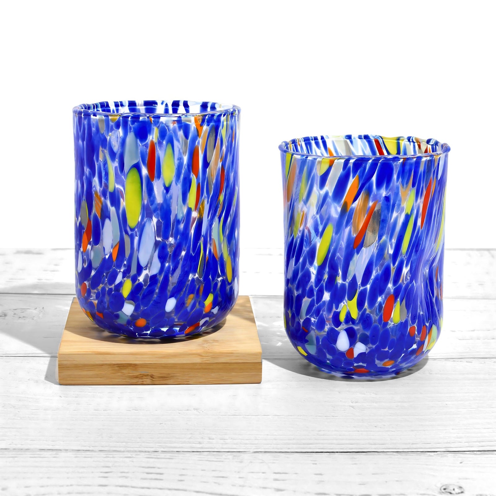 Set of 2 Murano glass tumblers with assorted colors, featuring elegant design from Fresca Due for stylish drinks.