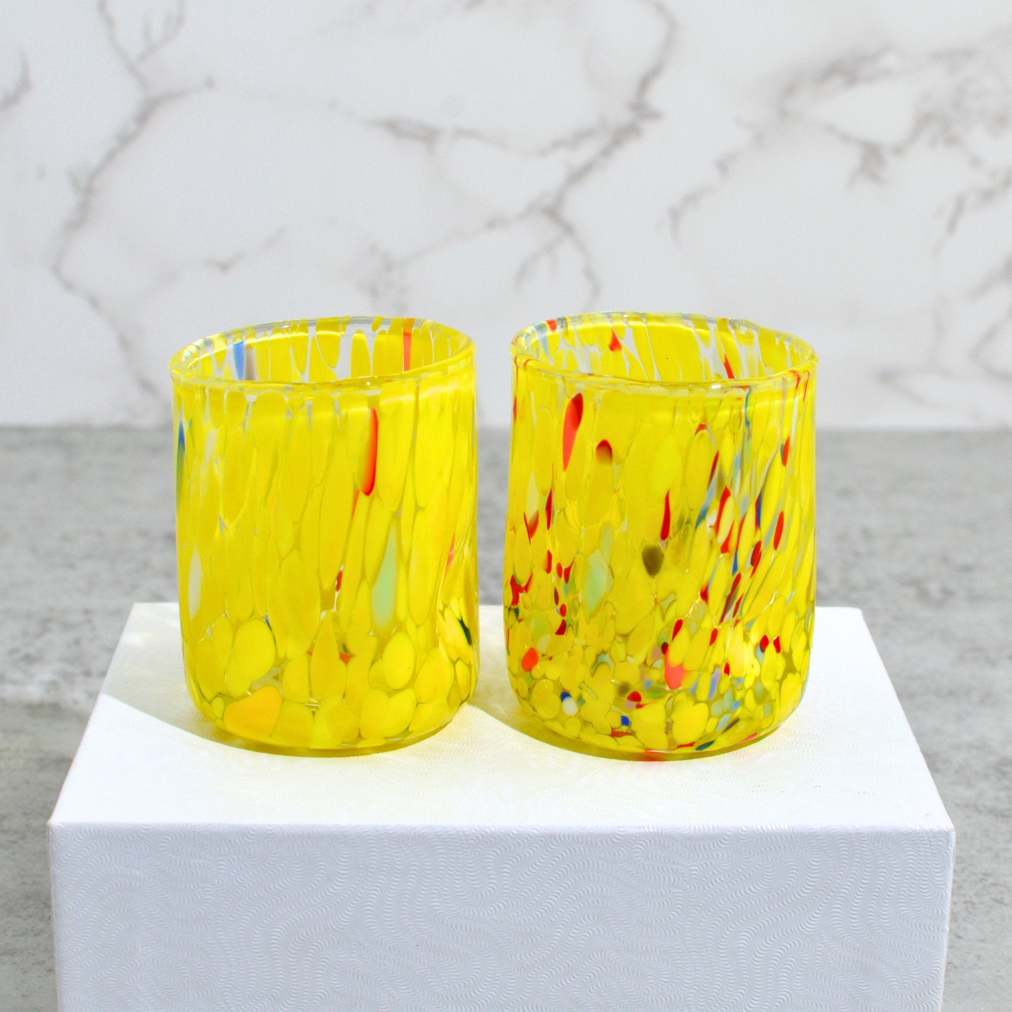 Set of two yellow Murano glass Fresca shot glasses made in Italy, featuring vibrant handcrafted design by MyItalianDecor.