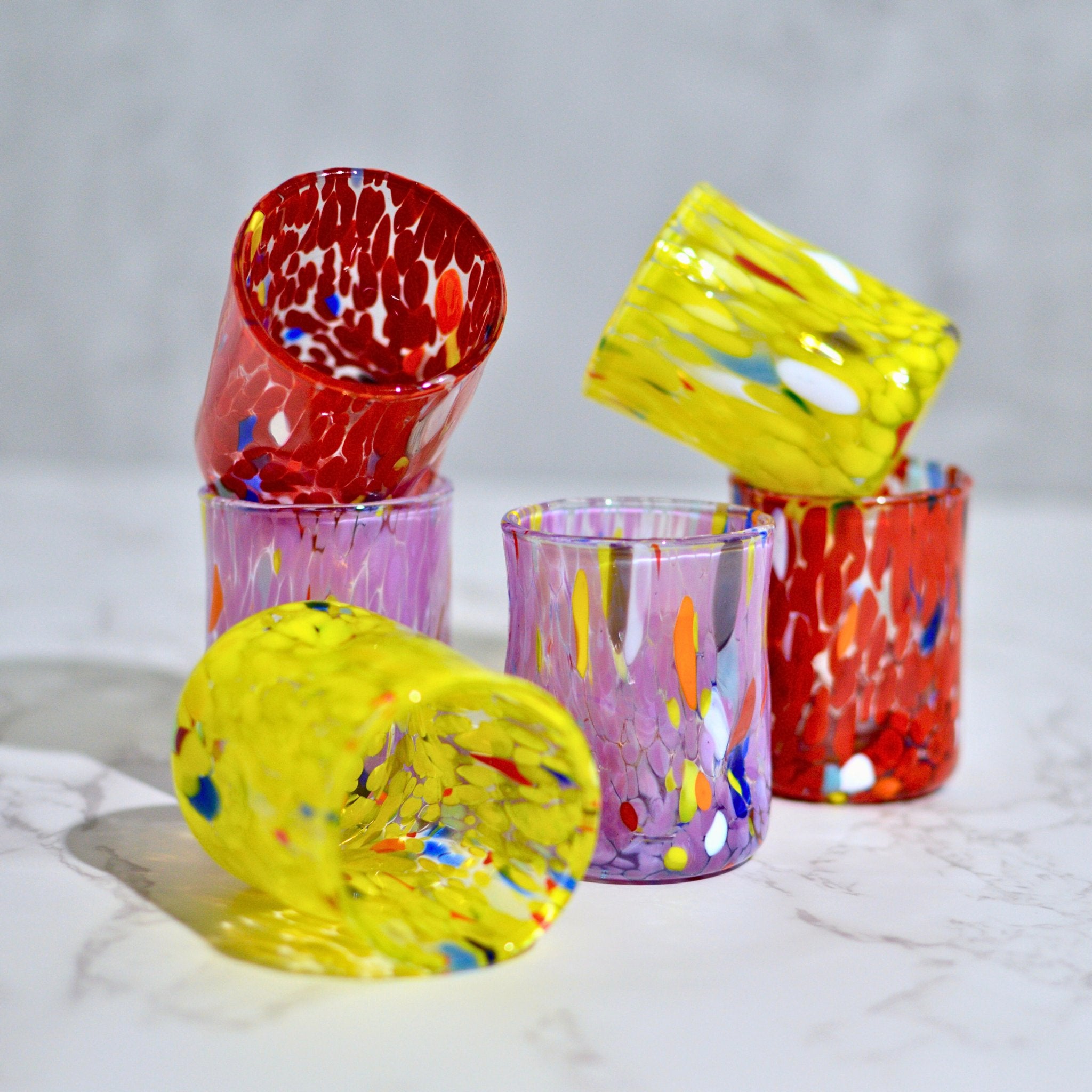 Set of two Murano Glass Fresca shot glasses stacked, made in Italy, featuring vibrant, handcrafted Italian glassware.