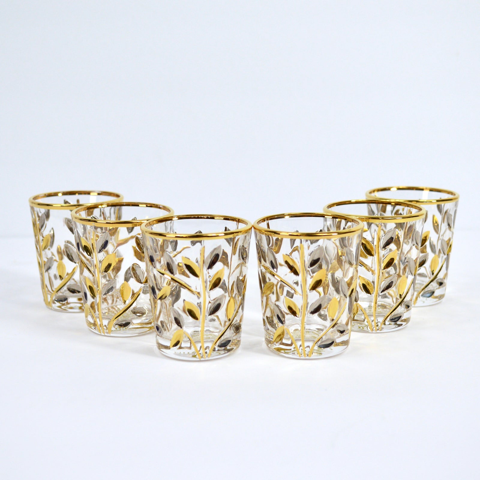 Set of Italian Crystal shot glasses with platinum and gold accents by DZ, featuring elegant flowervine designs.