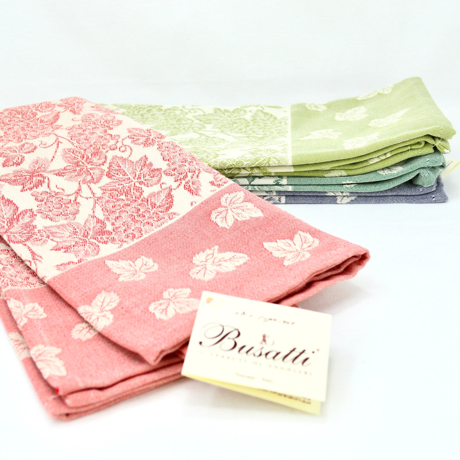 Busatti Uva kitchen towel in rose color with grape pattern, made in Italy, part of My Italian Decor's table linens collection.