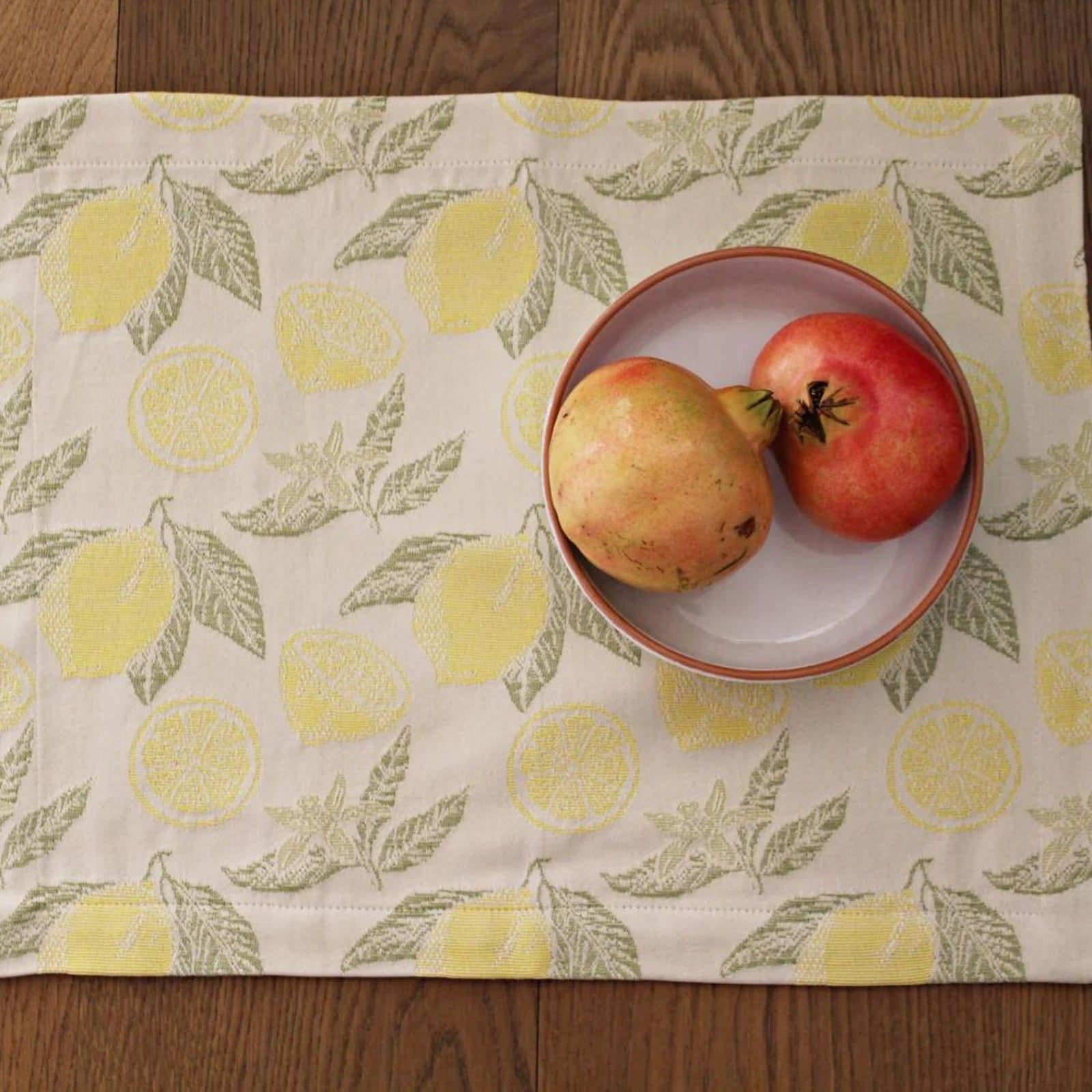 Busatti Lemon table runner made in Italy, featuring vibrant lemon print on elegant linen, perfect for Italian-style table decor.